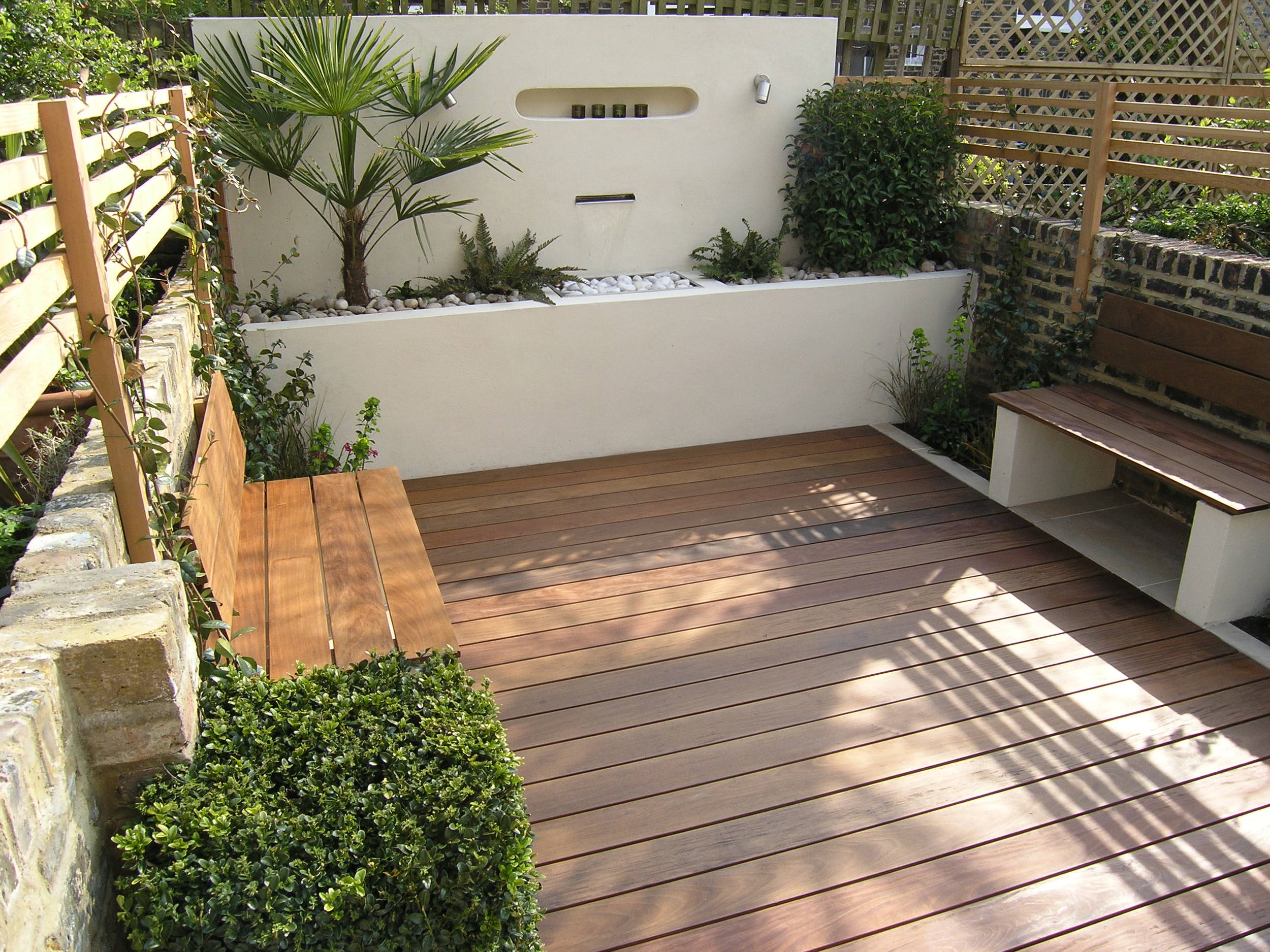 North London small garden landscaping ideas with decking and seating