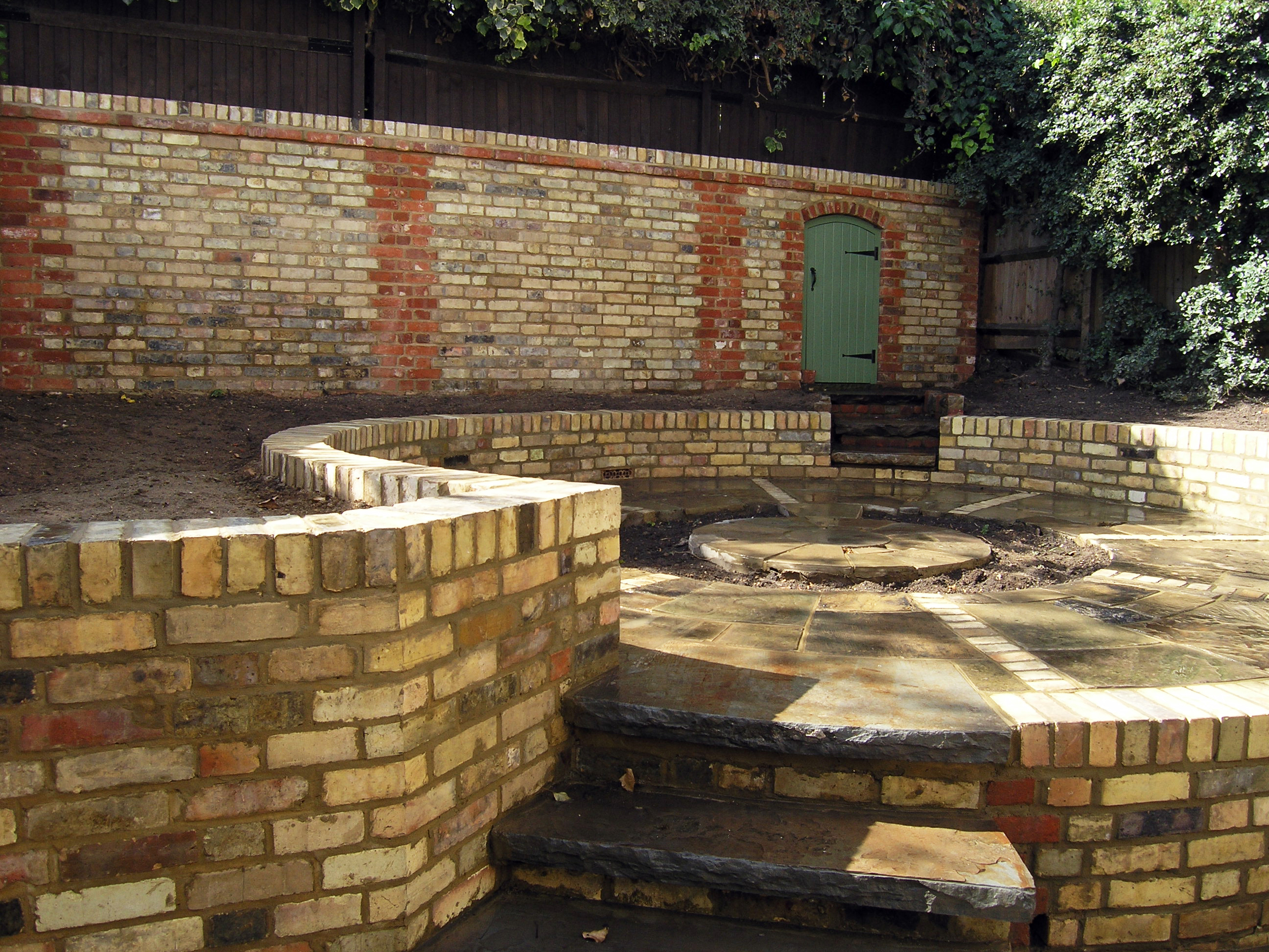 Garden landscaping in Highgate N6 with reclaimed bricks