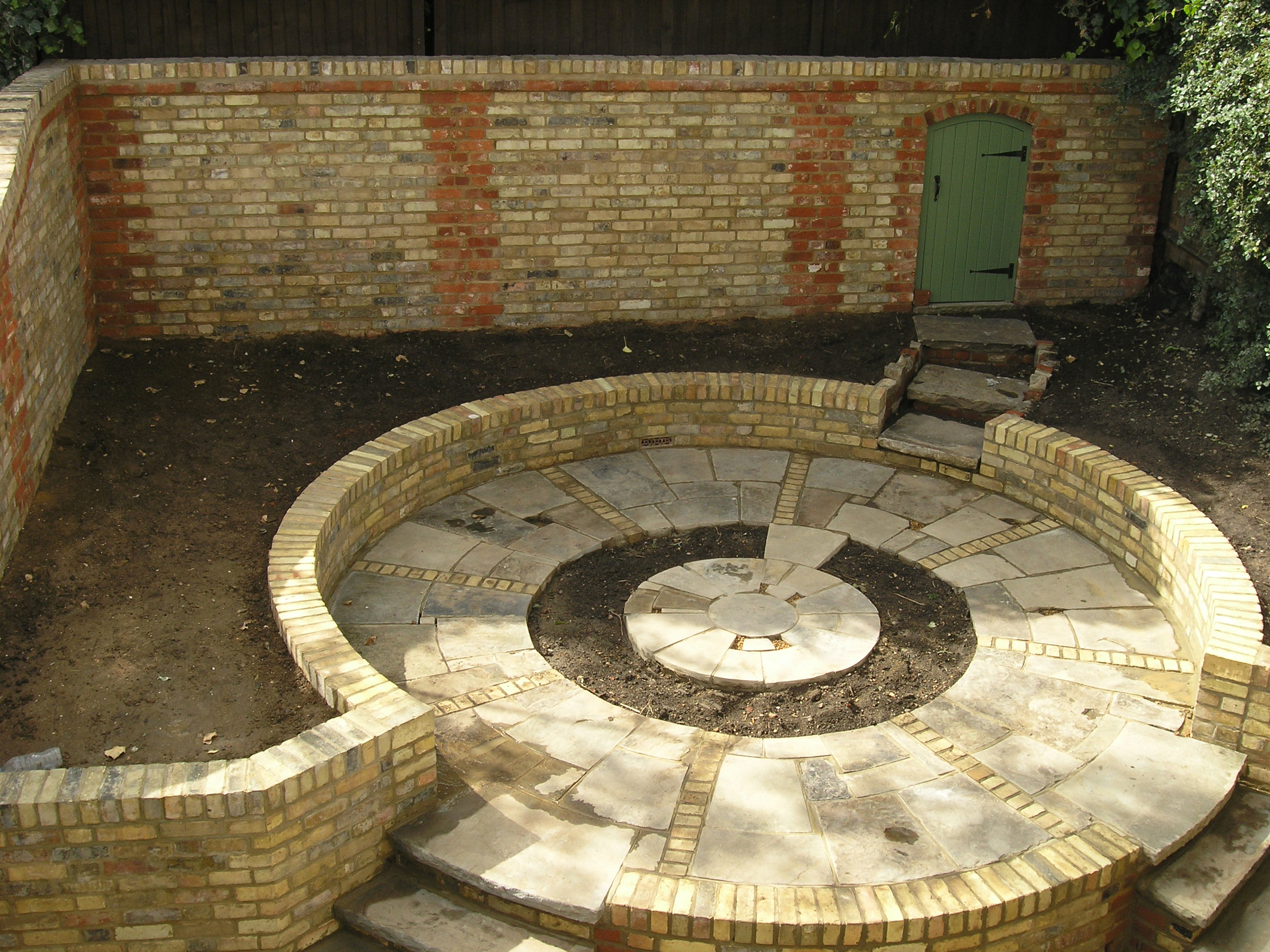 Garden makeover using reclaimed bricks in London N6 
