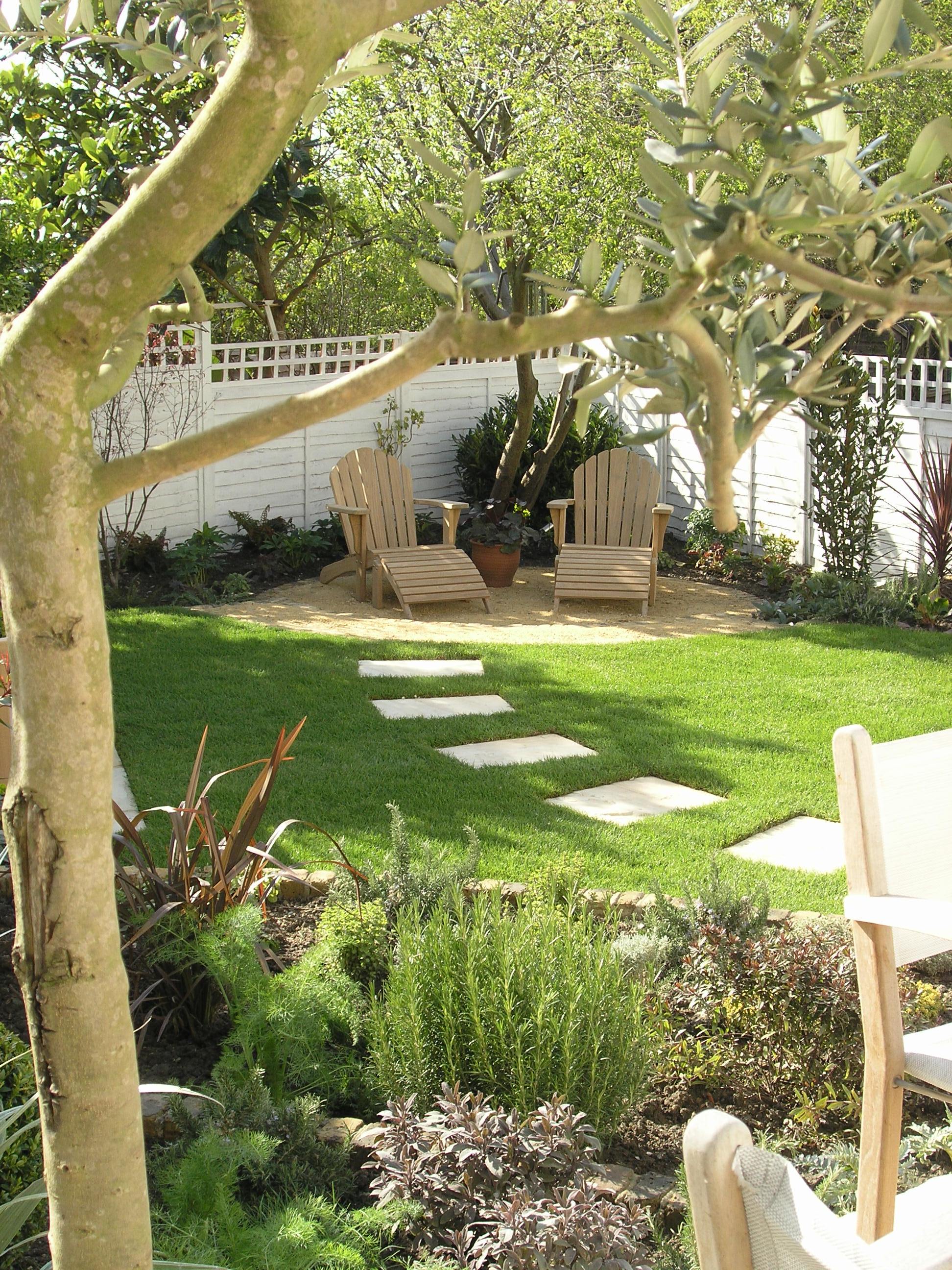 Stepping stones across the lawn of a Muswell Hill garden after landscaping