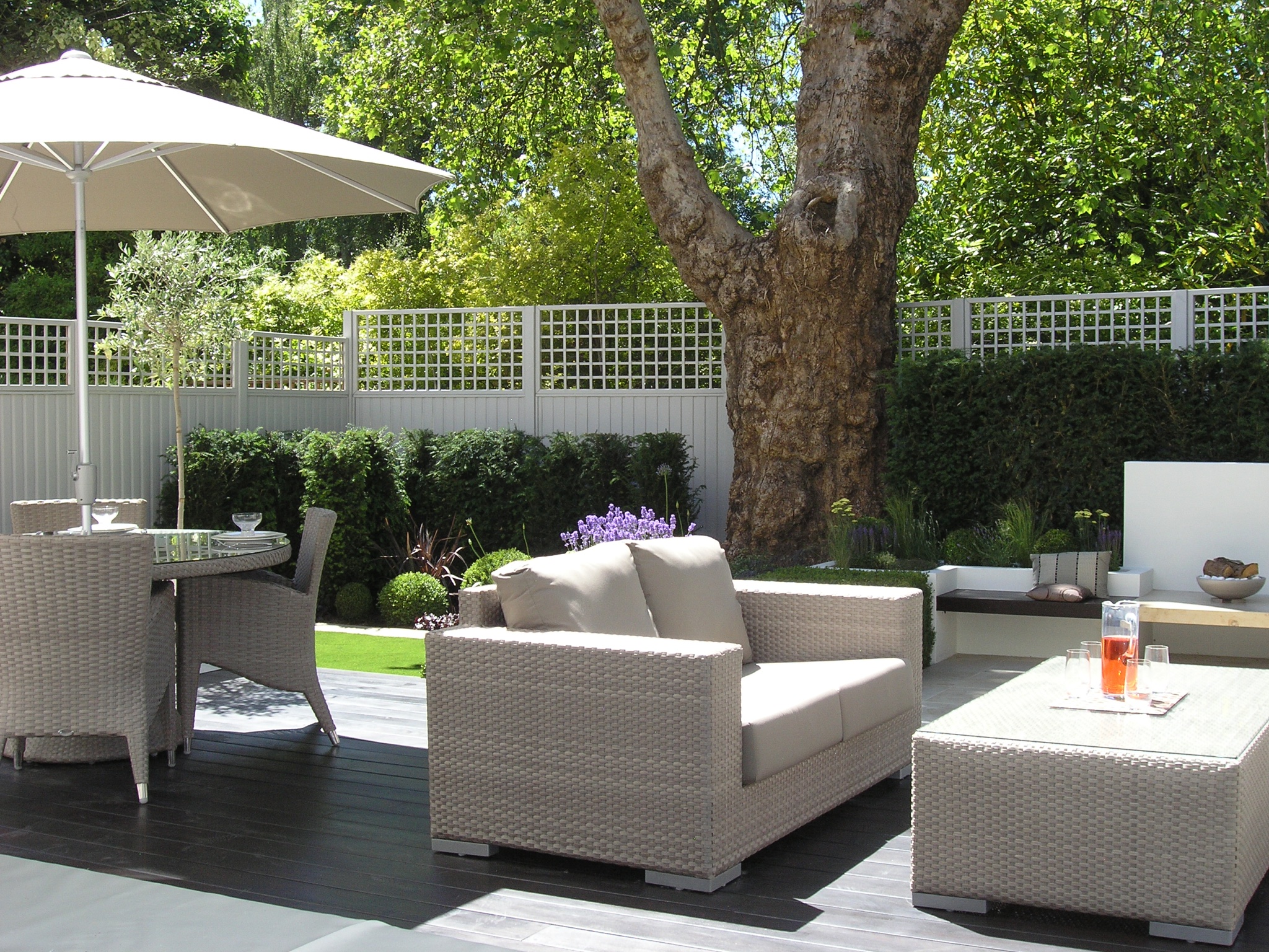 Modern landscaping in London garden with hardwood decking