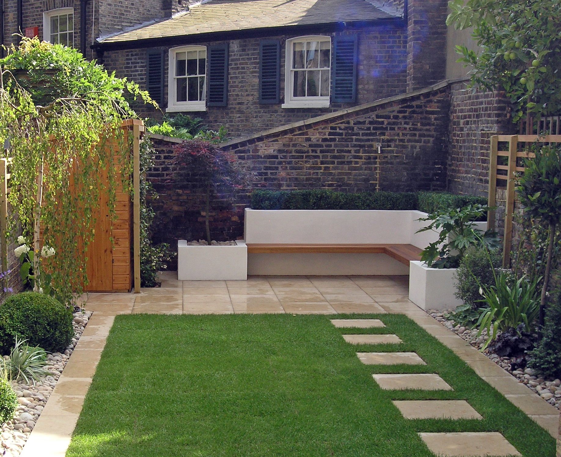 Modern North London garden design with stepping stones and patio seating area