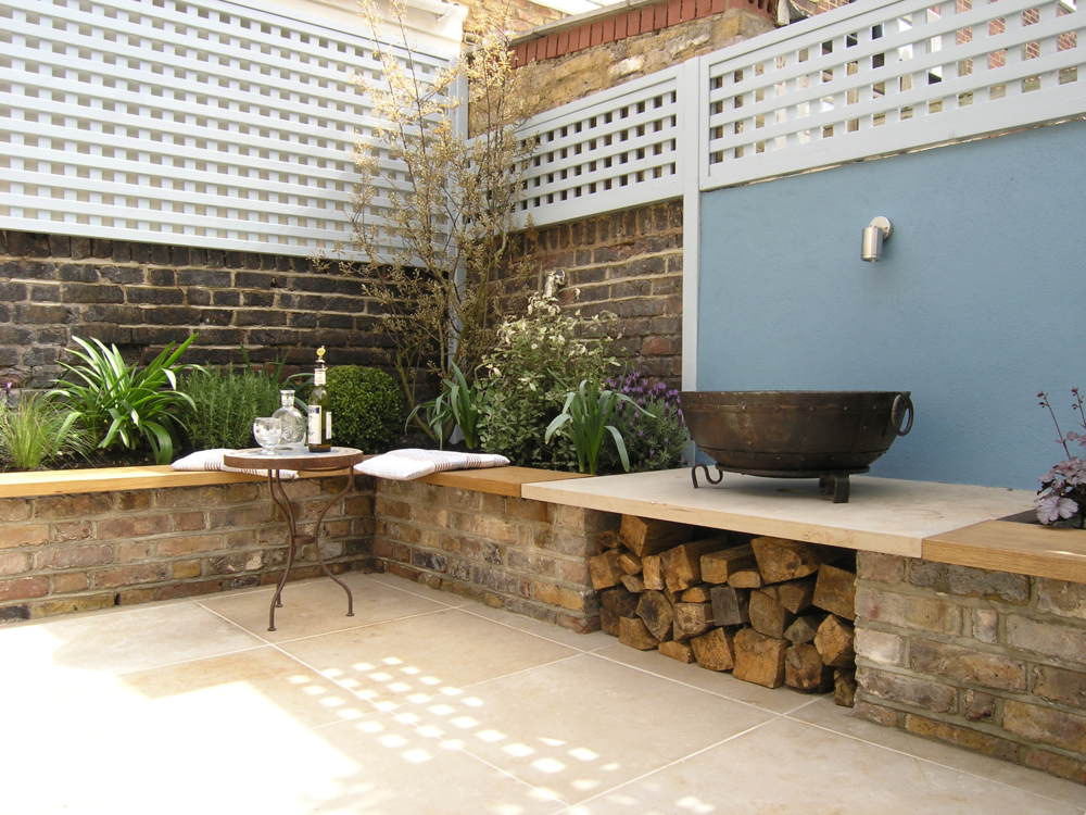  Firebowl on a limestone plinth in a stunning courtyard garden in Islington redesigned by Living Gardens on a Provencal theme. 