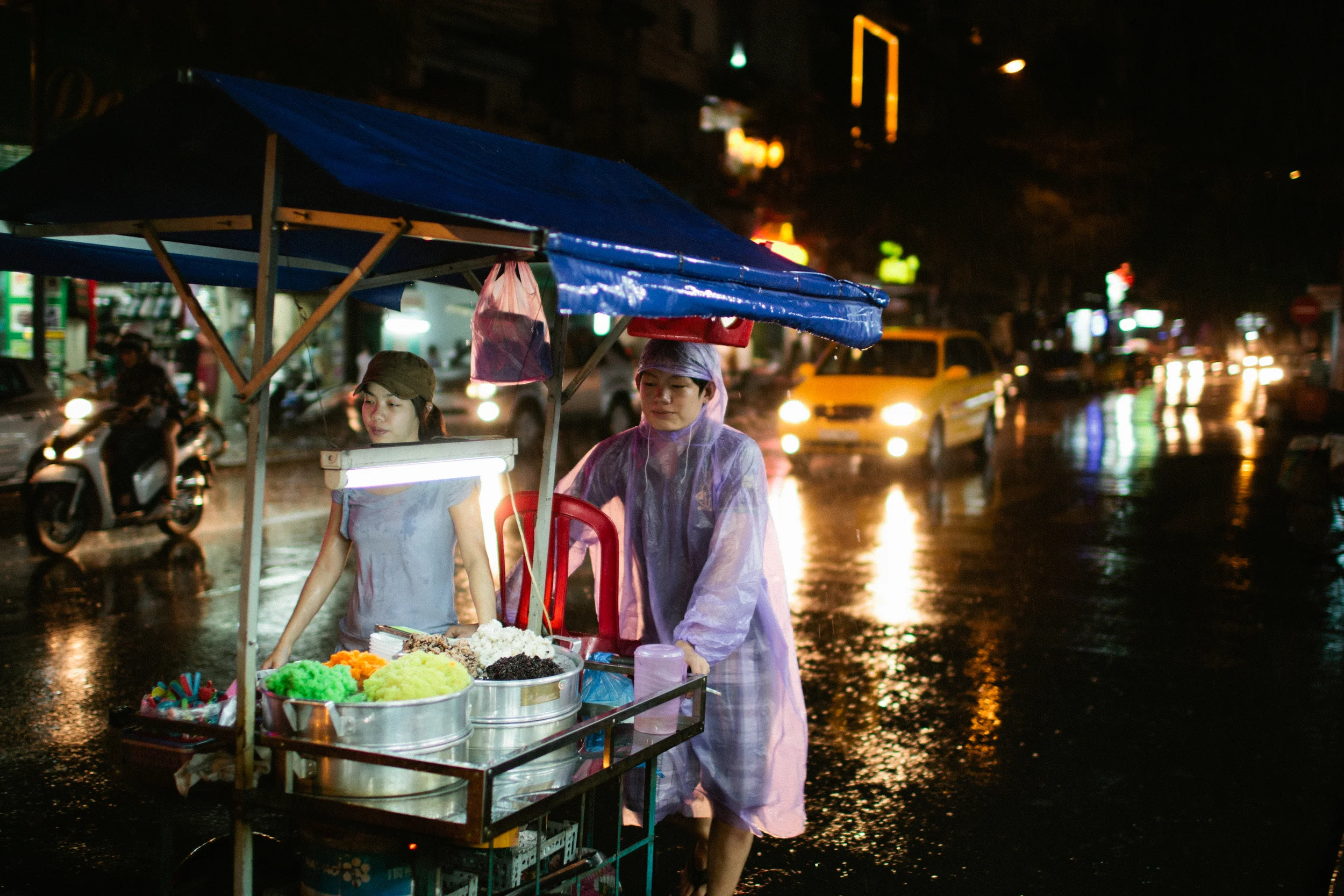 Out at a market in HCMC/Saigon one day when it started to rain. Shot in 2011 with a Canon 1D3 and 35L.