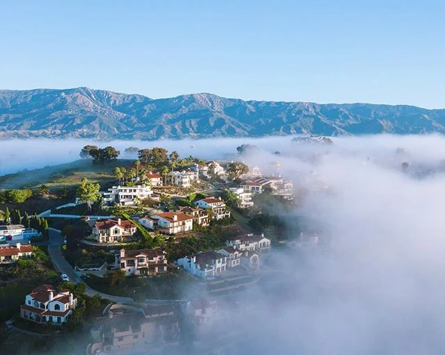 An emerald hilltop embraced by morning inversion layer in one of my favorite neighborhoods.