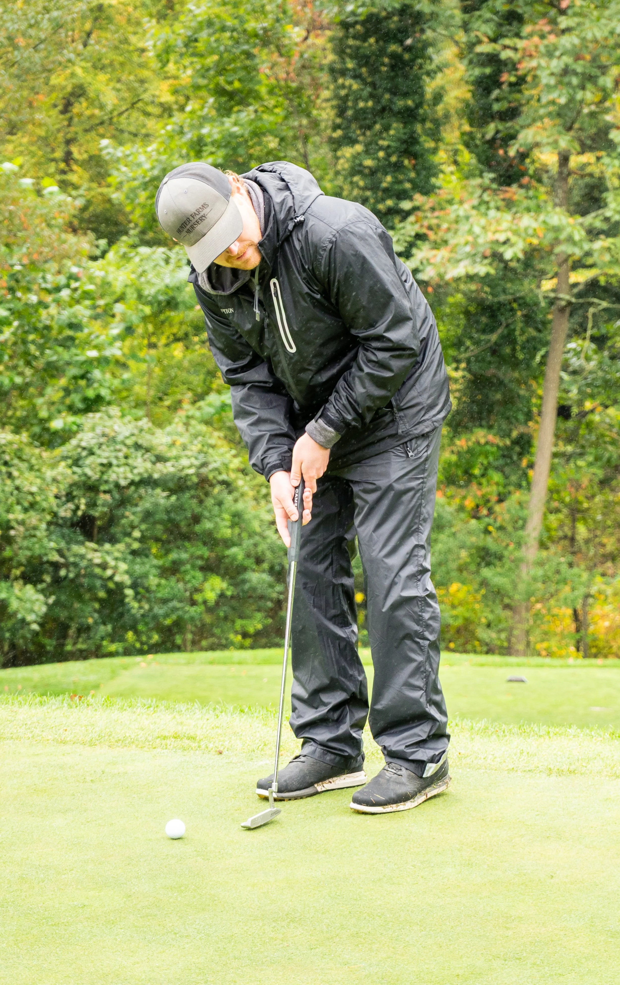 2025_CommunityCup-118_golfer putting.jpg