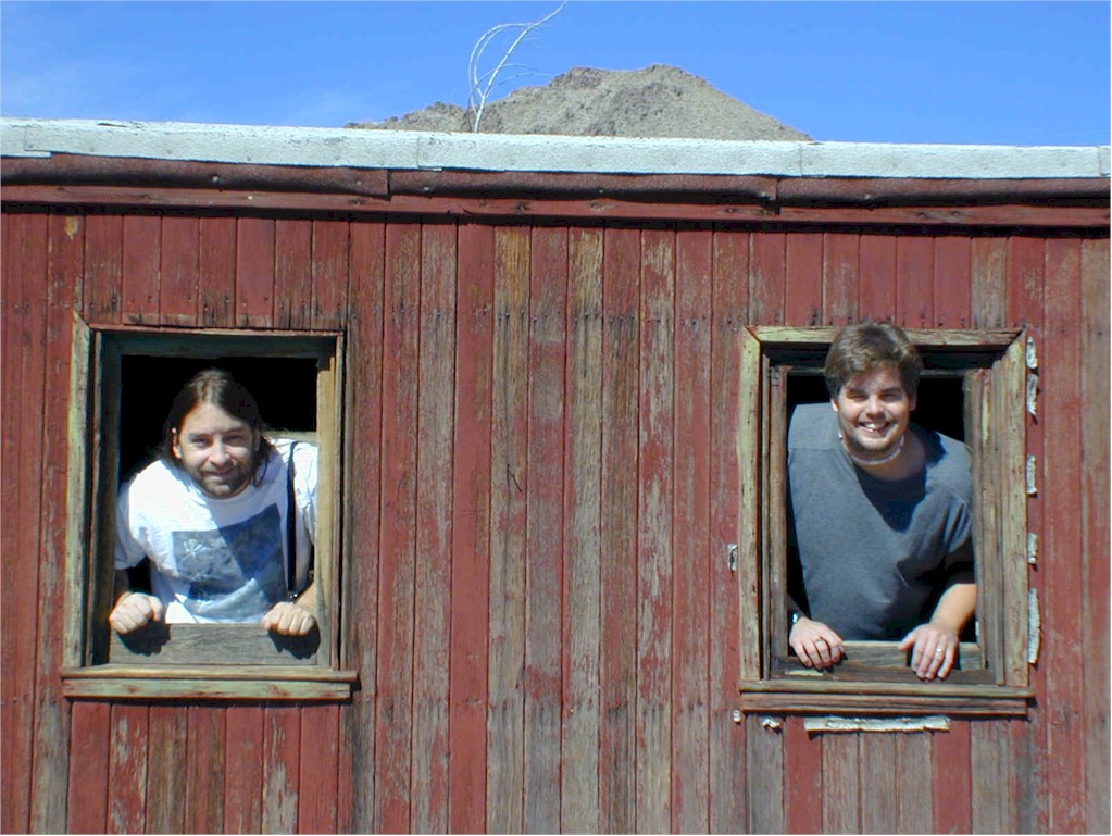 Exploring the inside of the caboose, Jonathan and Mike stick their heads out and say hi.