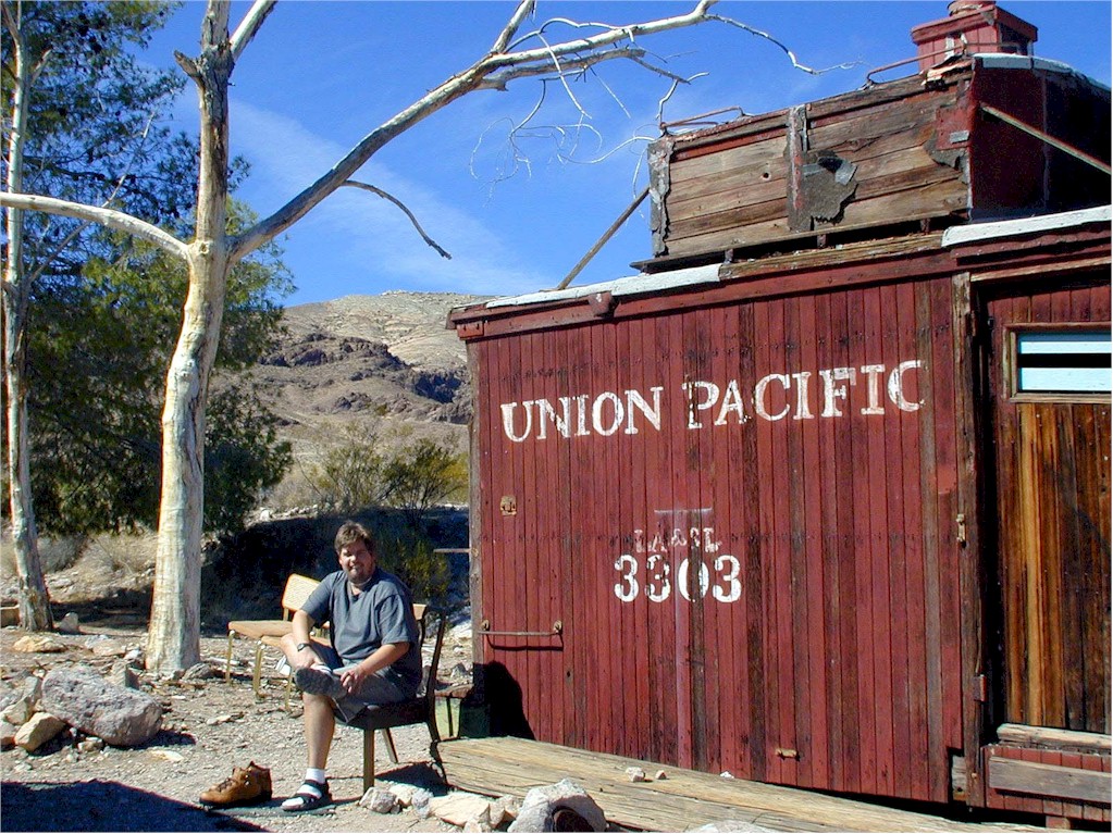 A Union Pacific caboose. Mike changes into hiking shoes.