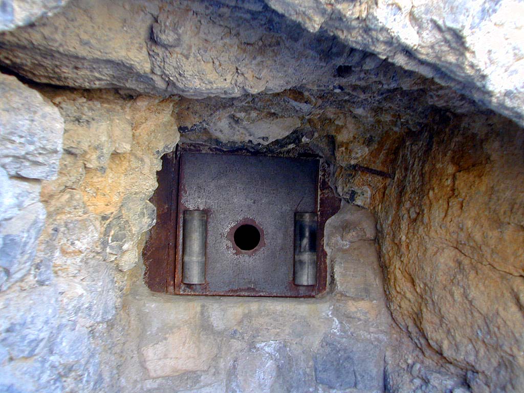Just what is going on with this? A small hole, a metal cover plate, a welded pipe to the hole on the inside.