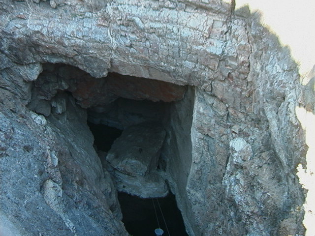 View of Devil's Hole. It is a dark pool in a deep crevasse