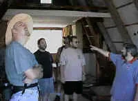 Chuck points out some architectural feature or else someone just asked the question "Where's Steve?"