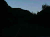 Driving through canyon as the sun sets