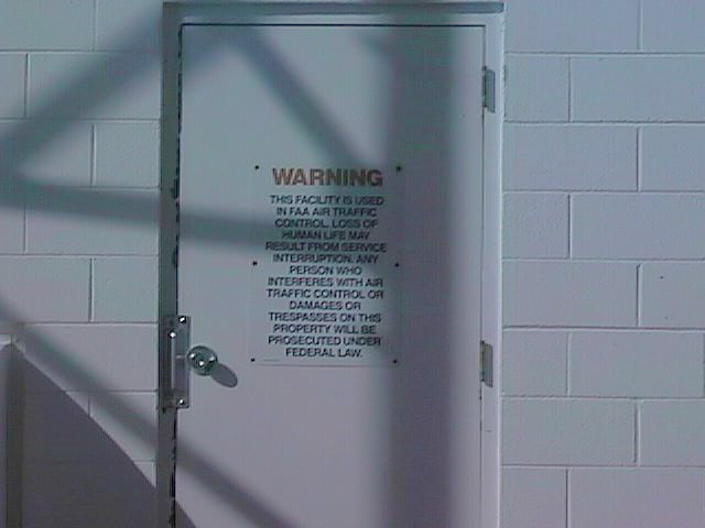 Warning: This facility is used in FAA air traffic control. Loss of life may result from service interruption. Any person who interferes with air traffic control or damages or trespasses on this property will be prosecuted under federal law.