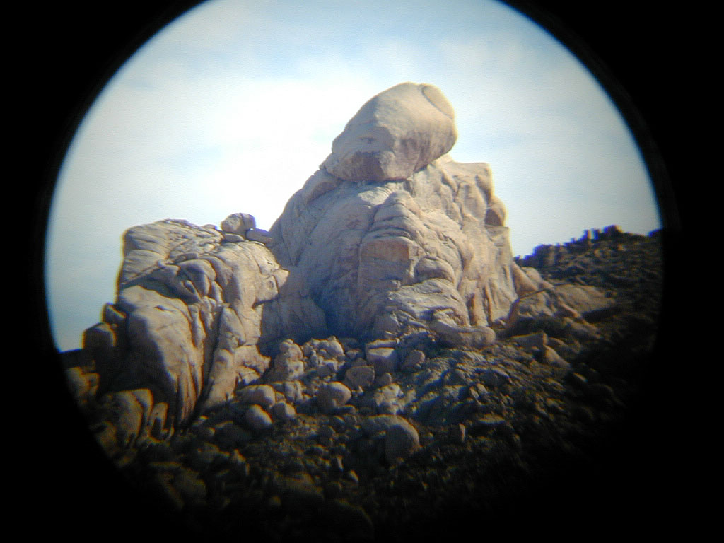 Telephoto view of one of the "knobs" near Knob Hill. You can see this (tiny) knob in the picture on the left.