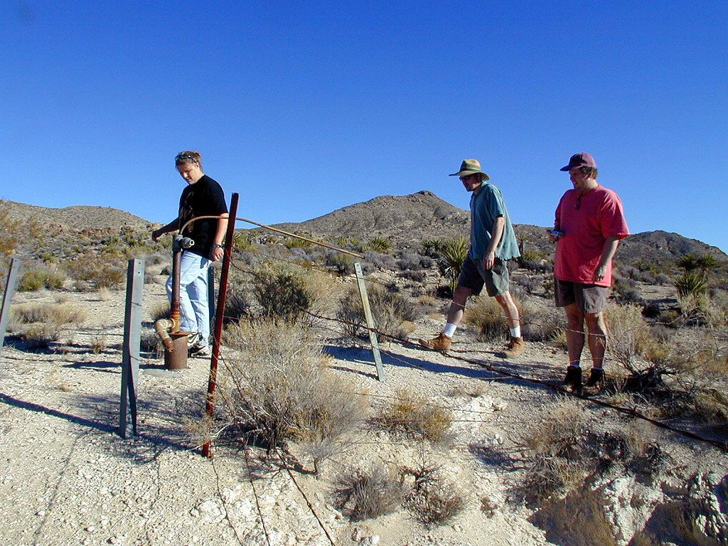 Amy, Ted, and Mike patrol the perimeter of the fenced off mine entrance.
