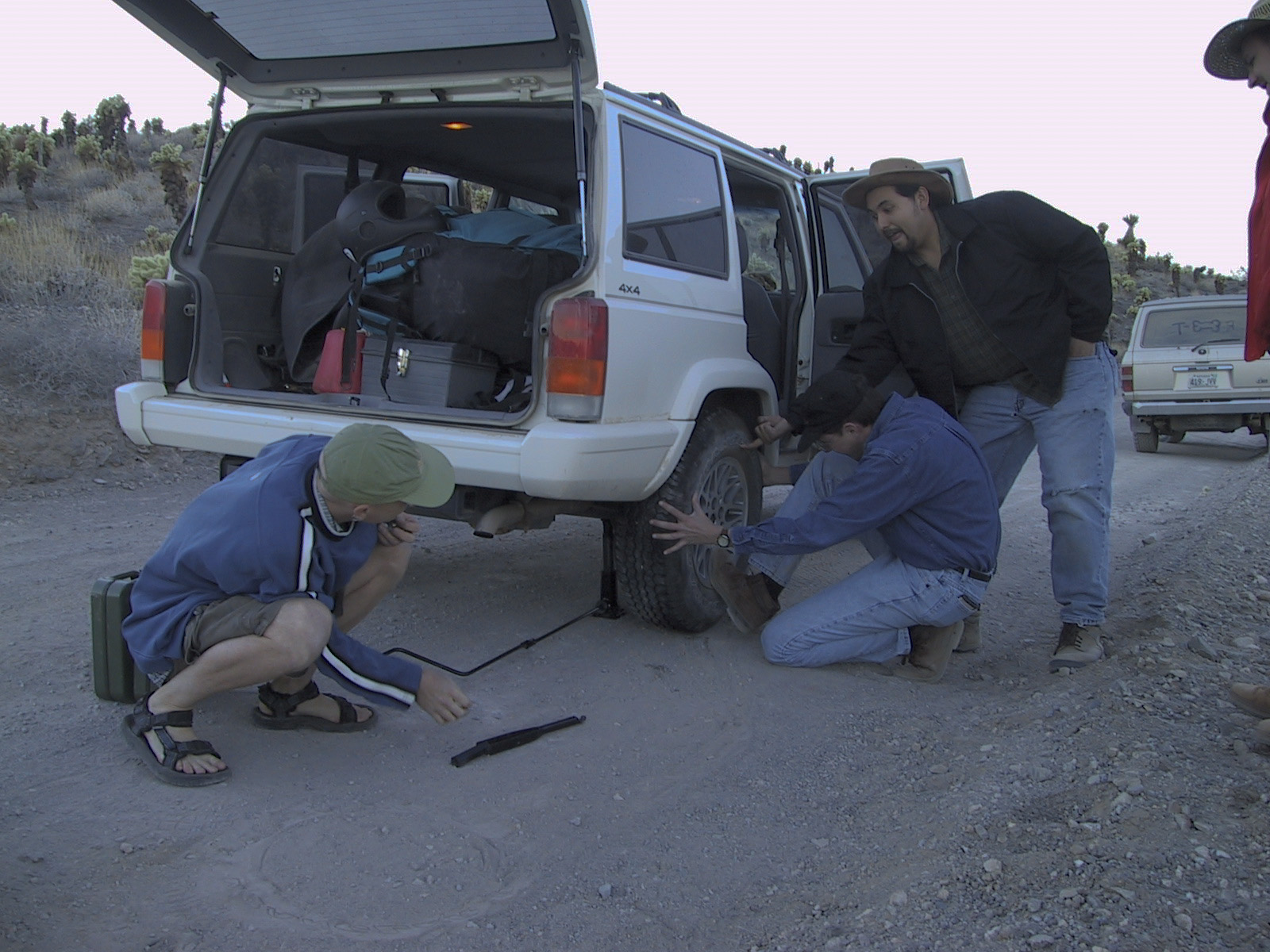 Dwight decides to "lift a finger" and help with the tire changing.