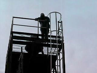Chuck is atop the tower.