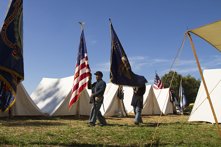 A USCT unit's standard bearers march to formation before the reenactment of the battle of New Market Heights; Henrico County, Virginia, September 2014. Photo: EHP