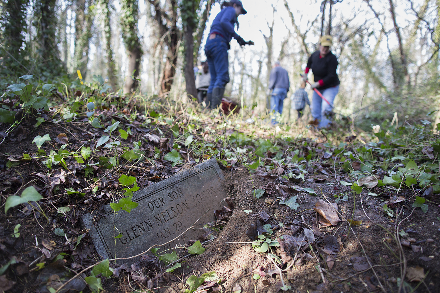 Grave of Glenn Nelson Jones, a young boy, revealed during East End Cemetery work day, January 2015. ©brianpalmer.photos 2015