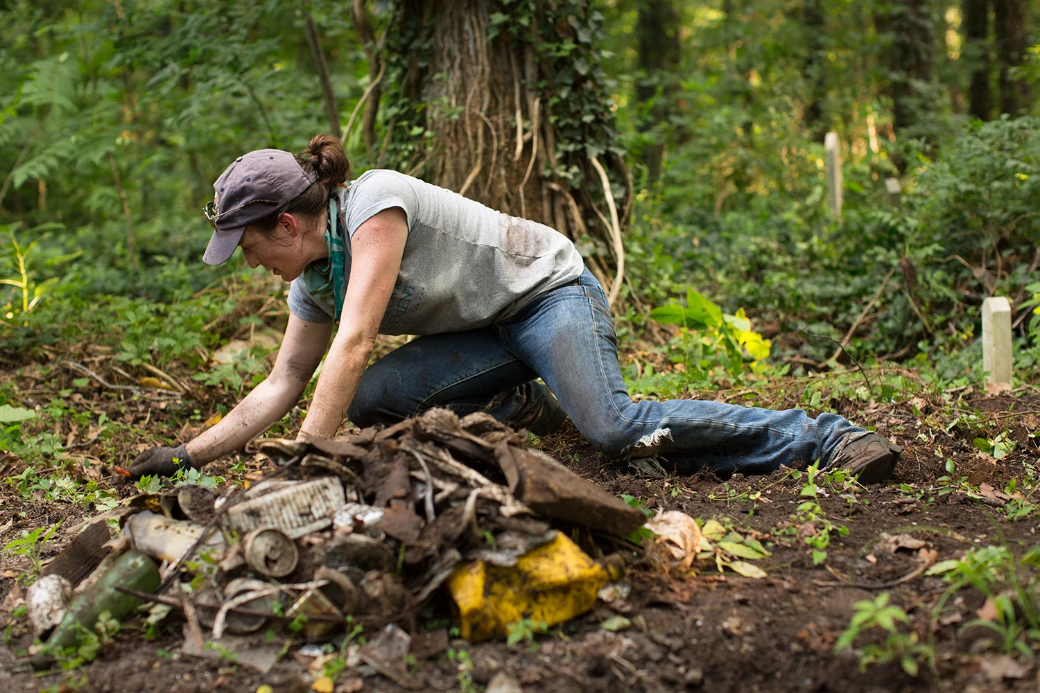 On a sweltering summer evening, Erin bent down to pick up a few pieces of plastic and ended up unearthing another trove of trash—bottles, beer cans, shingles, miscellaneous building materials. There's more under there, but every scrap we remove feels like a tiny step toward restoring the sanctity of the burial ground. East End Cemetery, Henrico County, Virginia, July 2016. Photo: BP