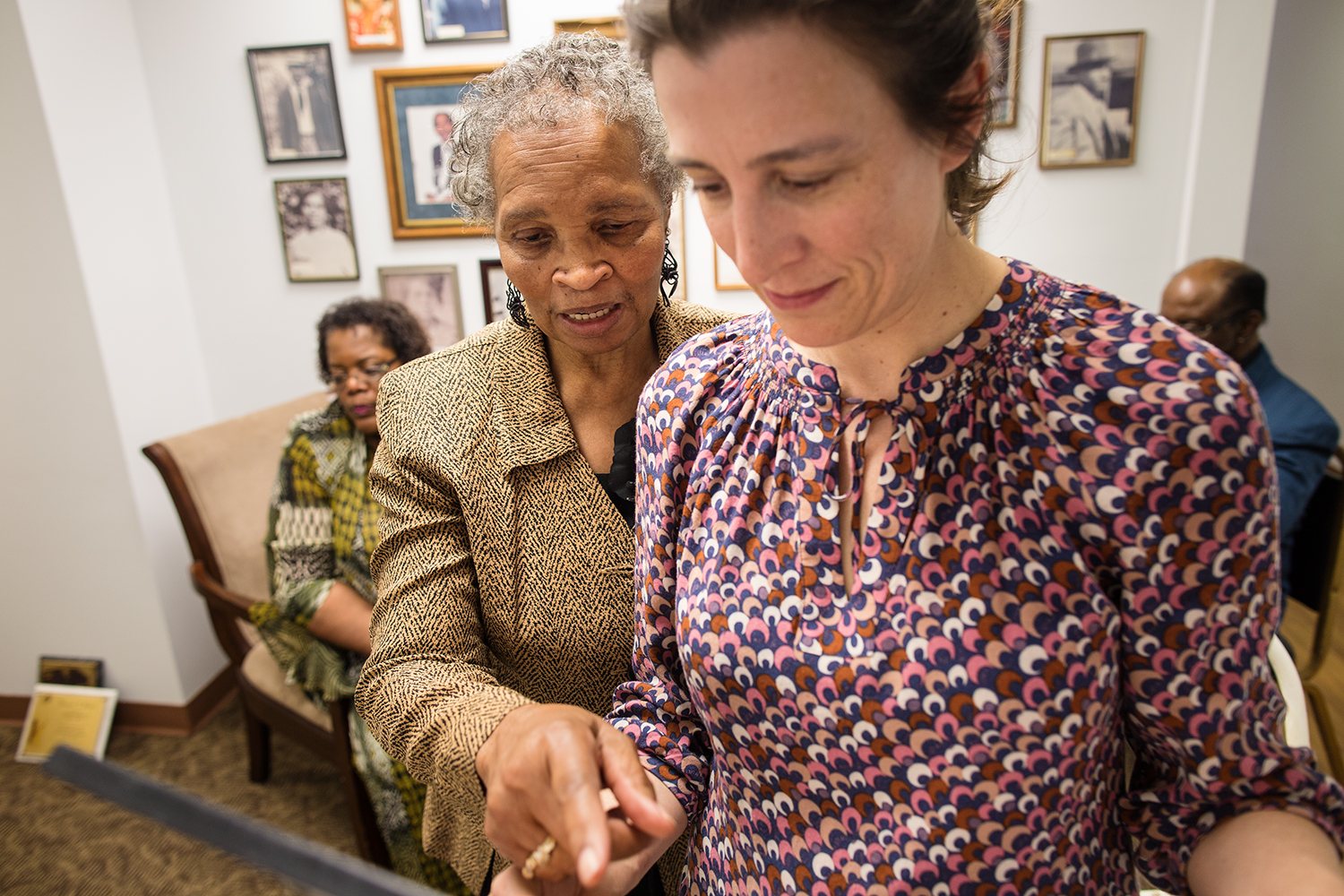  Ann Jones and Erin discuss photos to be rehung on the walls of Mt. Pilgrim Baptist Church's newly constructed wing, Williamsburg, VA, April 10, 2016 