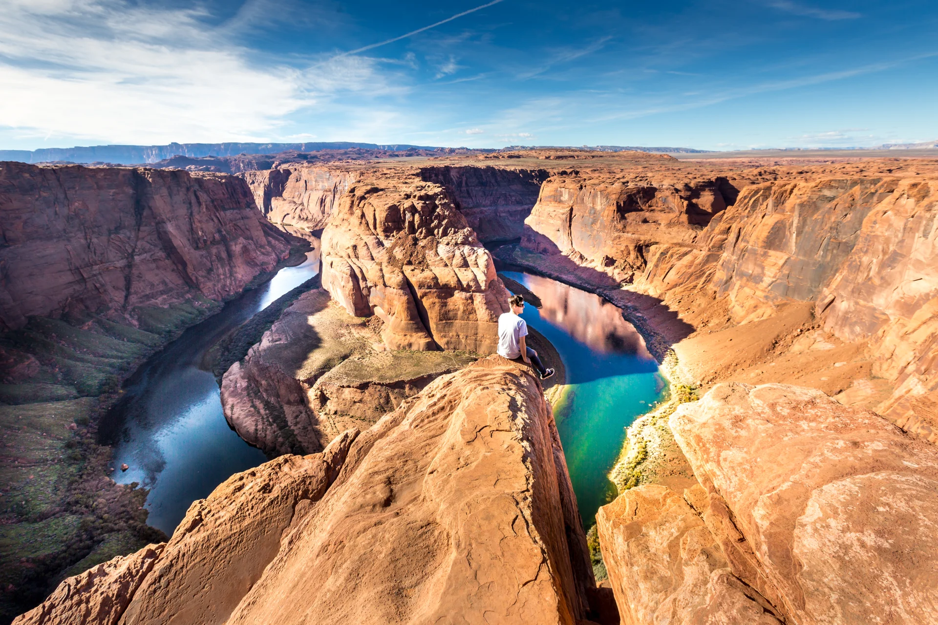 Guy sitting Horseshoe Bend Arizona