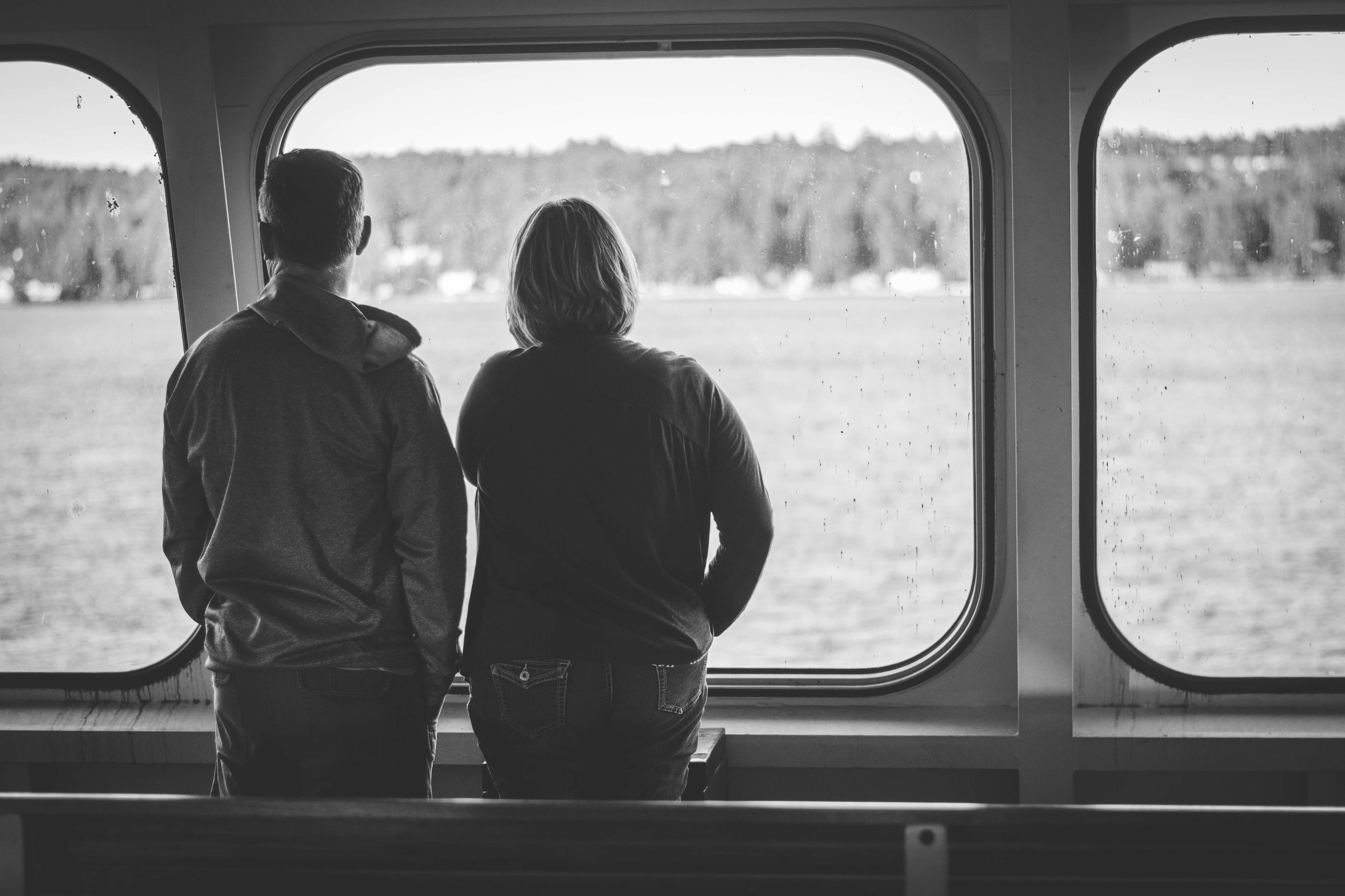  A couple watching outside the ferry windows 