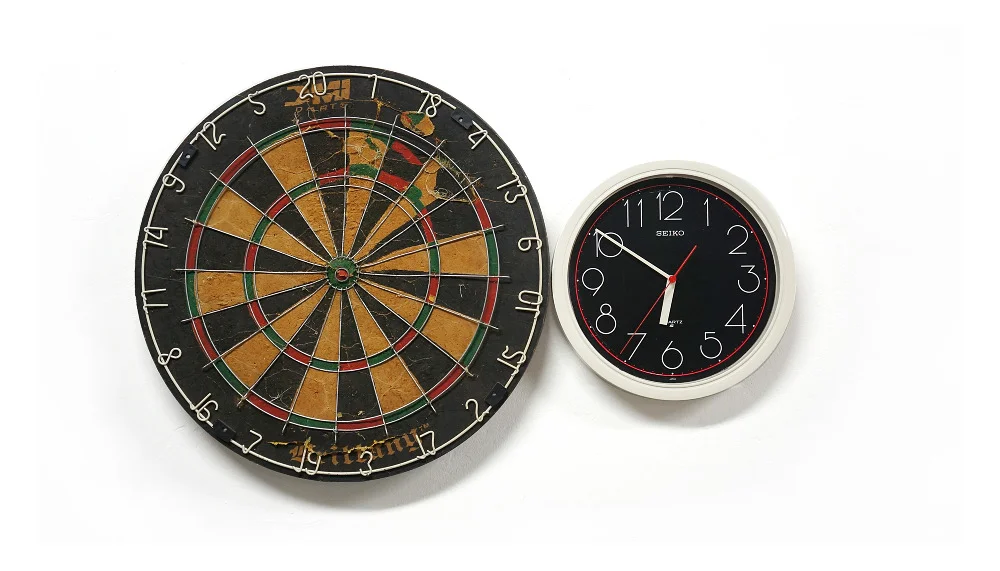 Agustina Woodgate, Hemispheres Destiny, Found dart board, clock, rotation motor, 15″ x 35″ x 3″, 2013