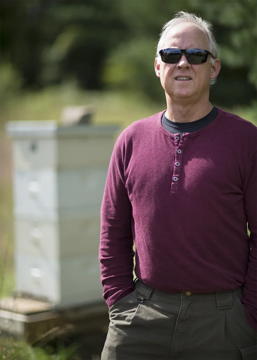 Mike Carroll is a bee cop. A longtime St. Paul police officer, he fell into this curious hobby by happenstance. Observing bee keeping from afar when visiting his wife’s family farm in central Minnesota, he ended up at the local community college for enlightenment. Retired now, he has been bee keeping for five years. This season he needed to depose one of his queen bees and place a stronger one on the throne, just a bit of human intervention that might actually benefit the colony. If their queen is a good ruler—she needs a strong genetic constitution—then honey production will be good, providing enough food for the colony over the hard winter months + allowing us greedy humans to harvest a few bucketsful.