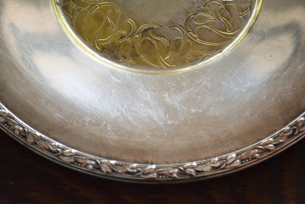 Detail of edge of round silver plated tray by William Rogers Co.