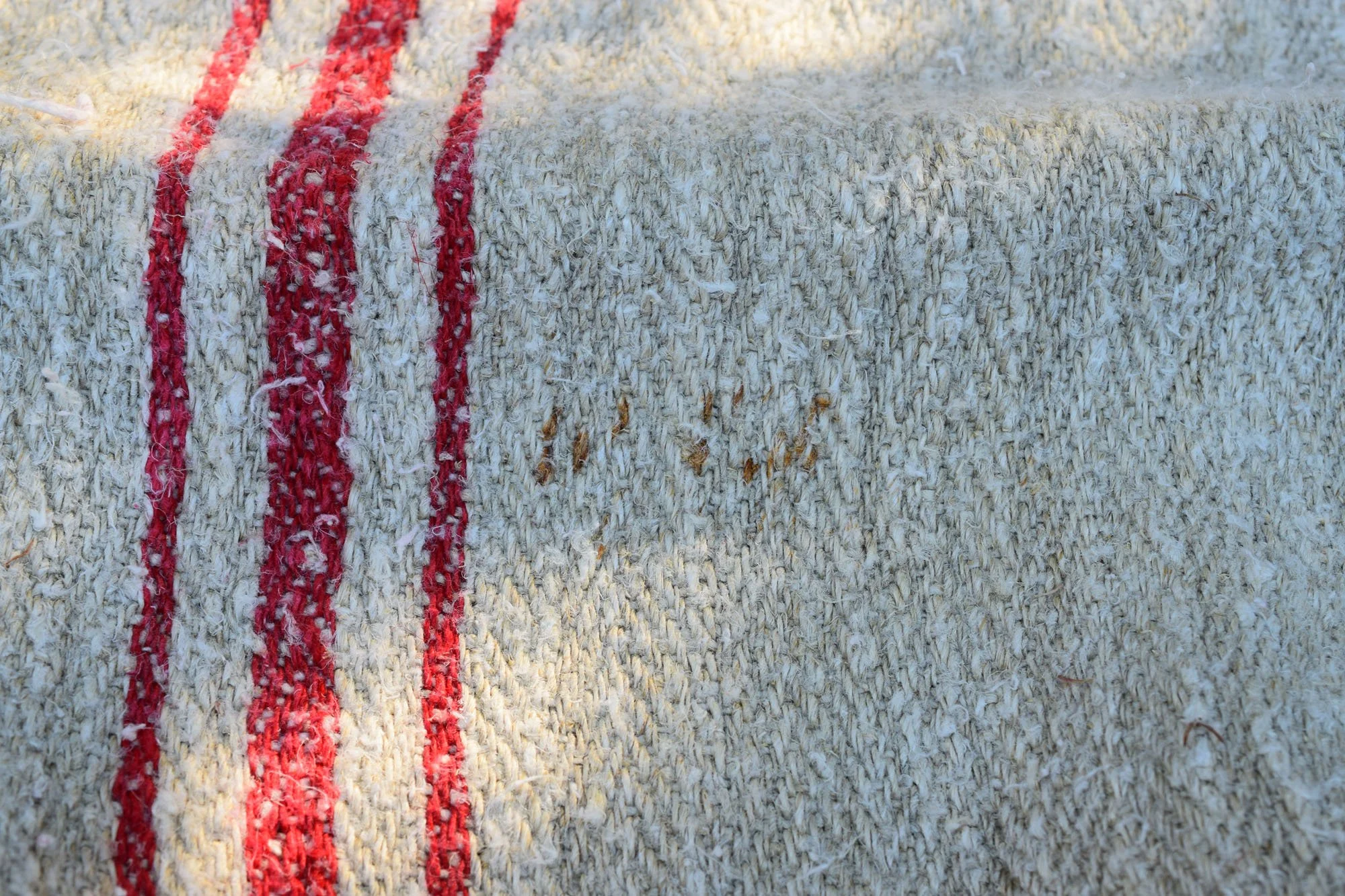 Vibrant Red Stripes on Antique Grain Sack