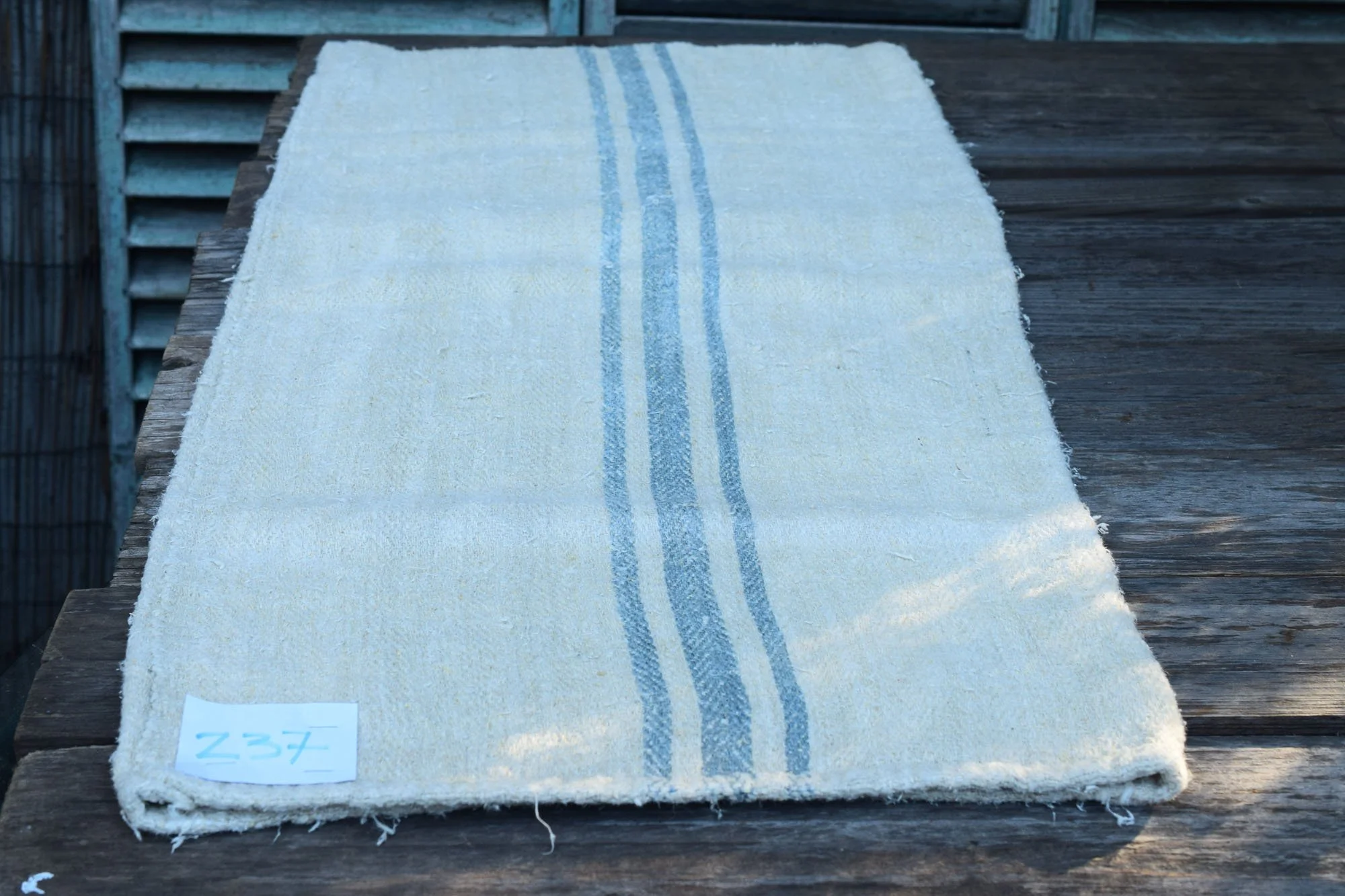 Old rustic grain sack with blue stripes