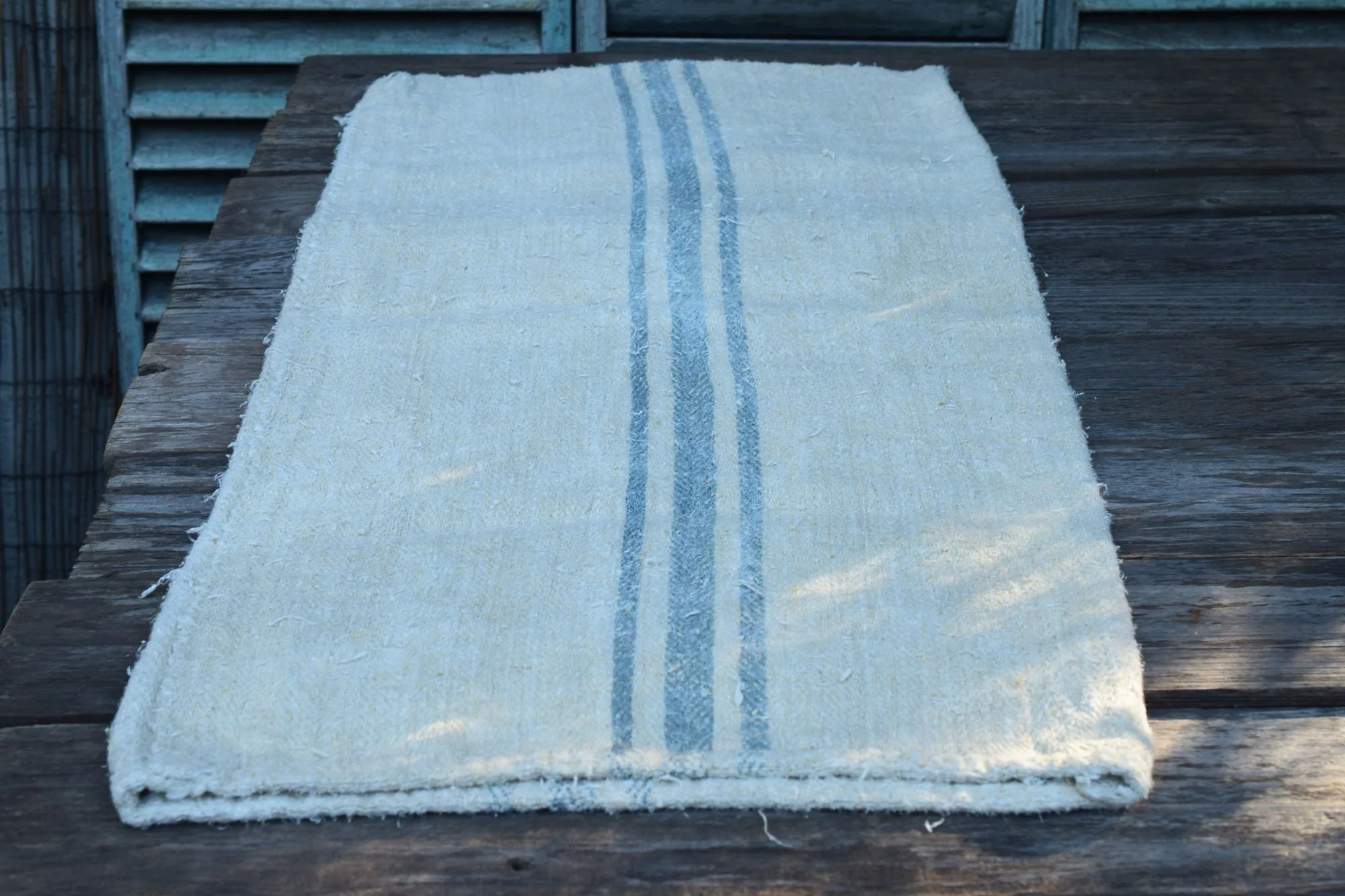Old rustic grain sack with blue stripes