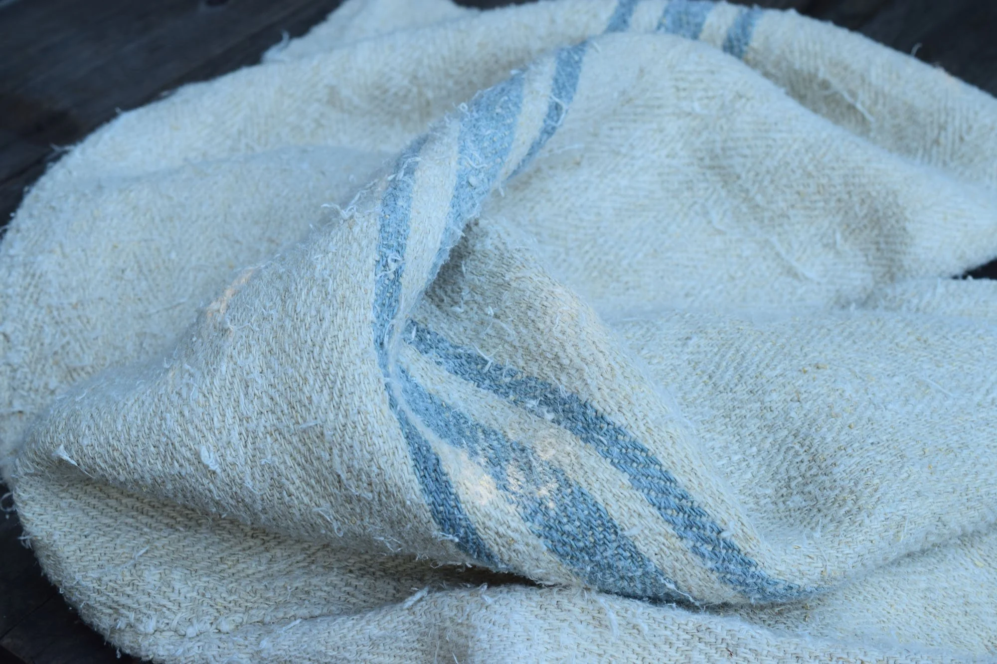 Old rustic grain sack with blue stripes
