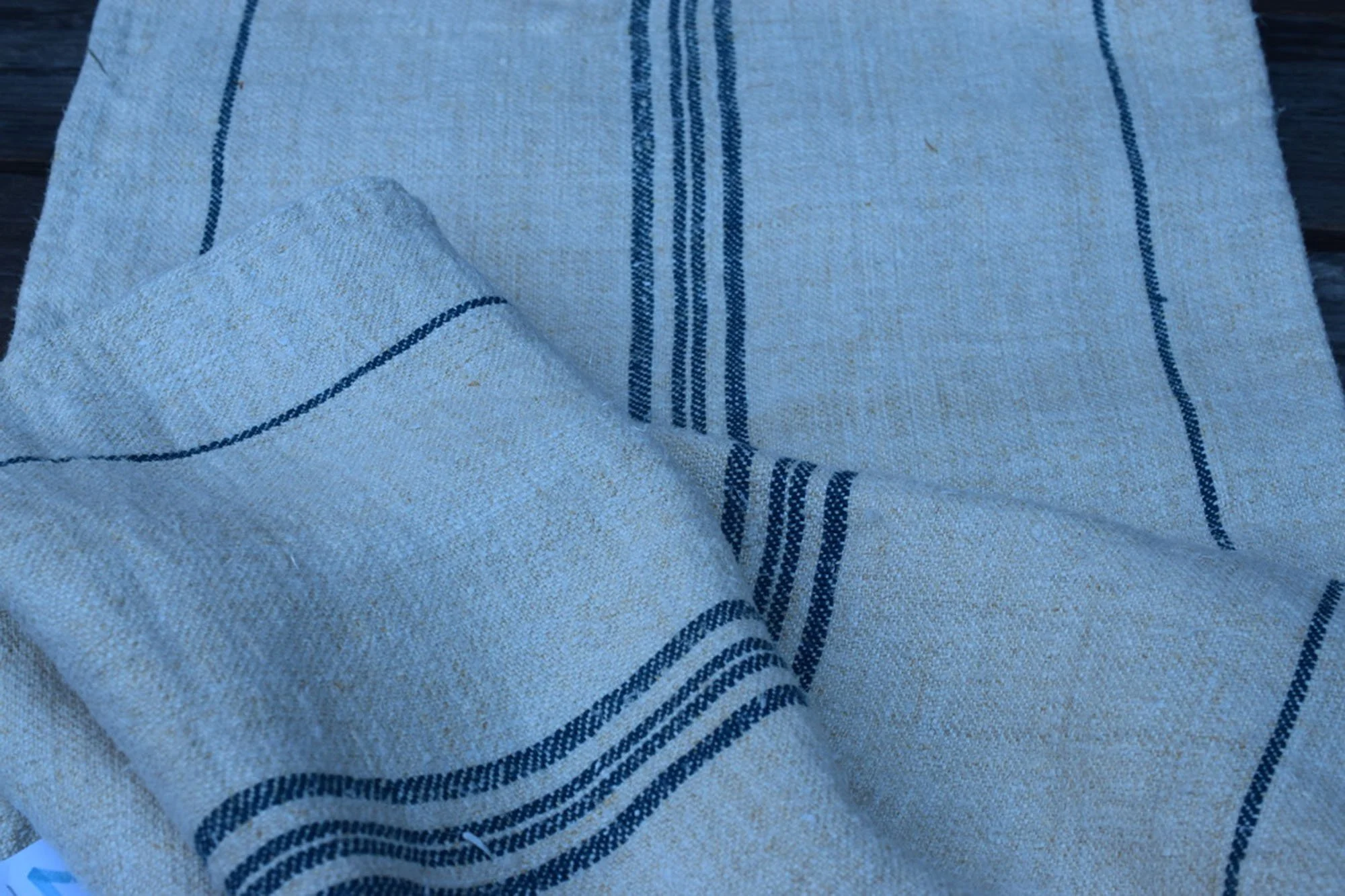 Old European Grain Sack with Four thin blue stripes down the center.