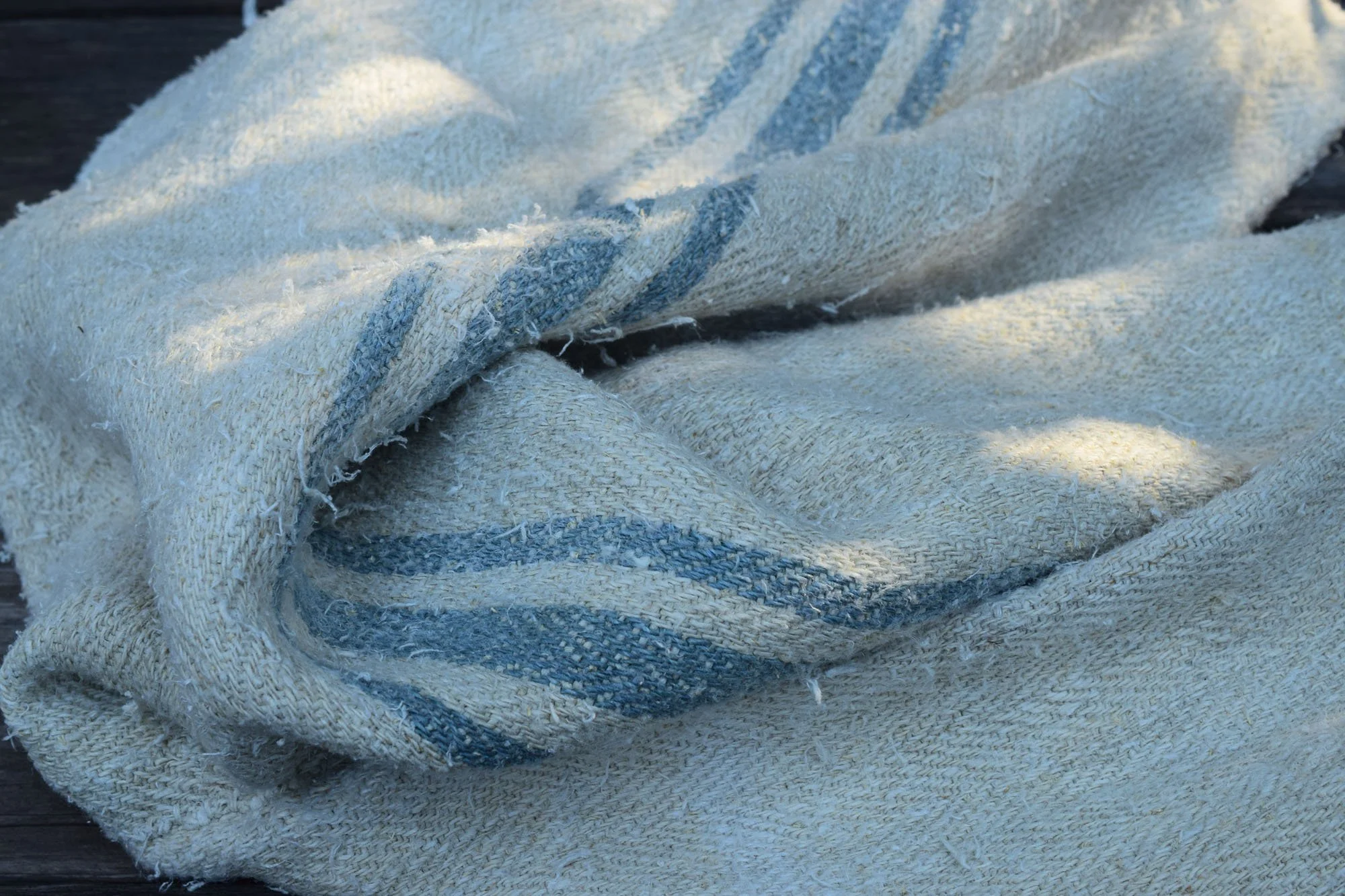 Old rustic grain sack with blue stripes