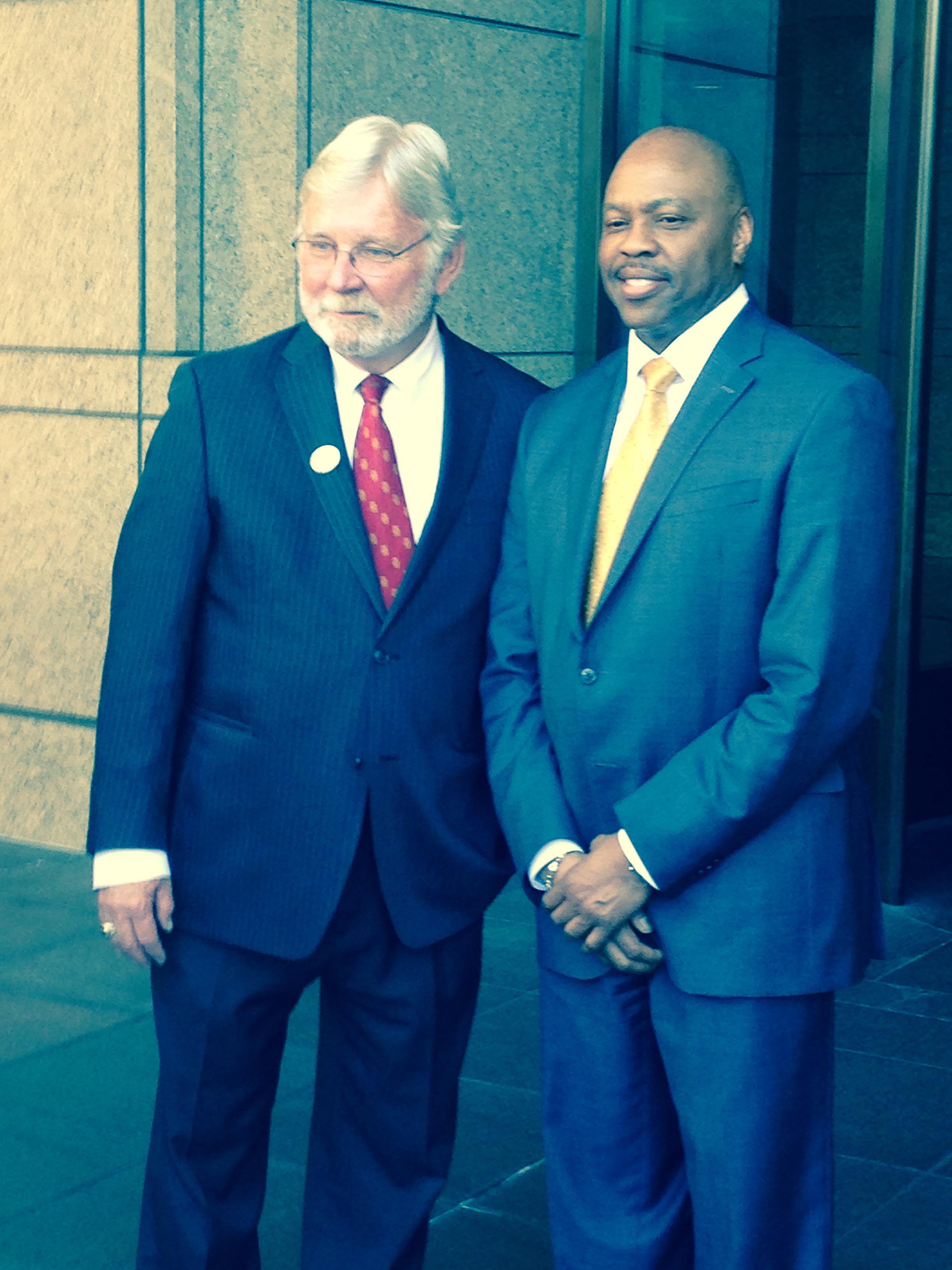 Art Leahy and Phil Washington pose for photos for the media.