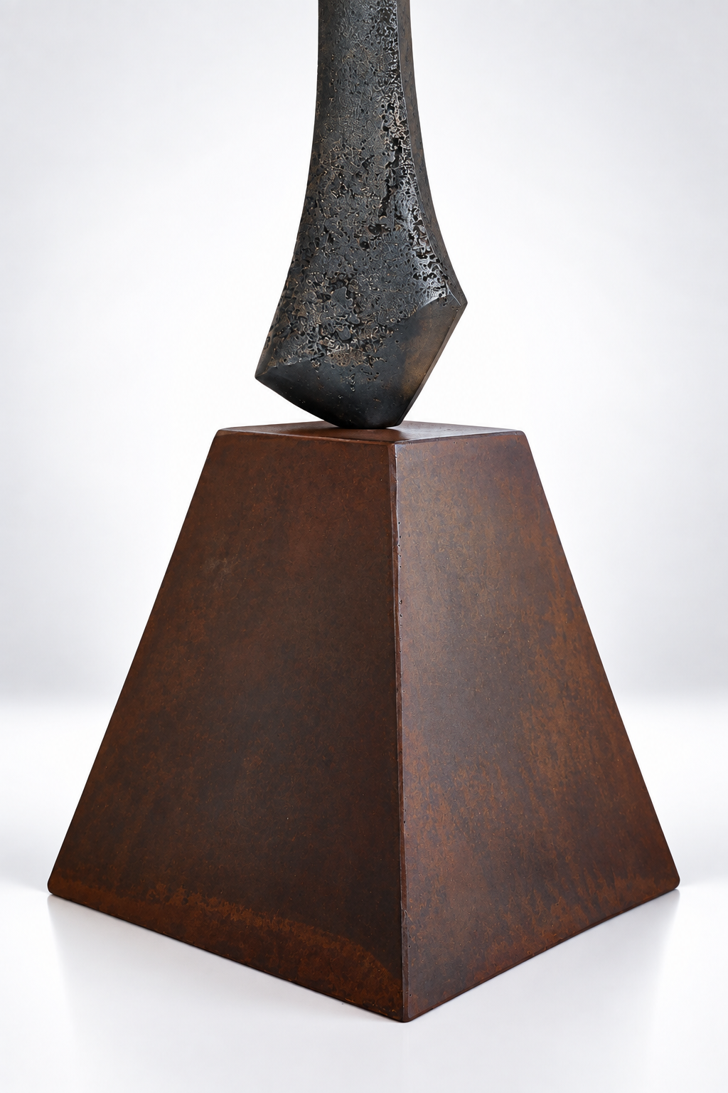 Detail shot of a metal sculpture by artist Kyle Lusk against a white gradient background.