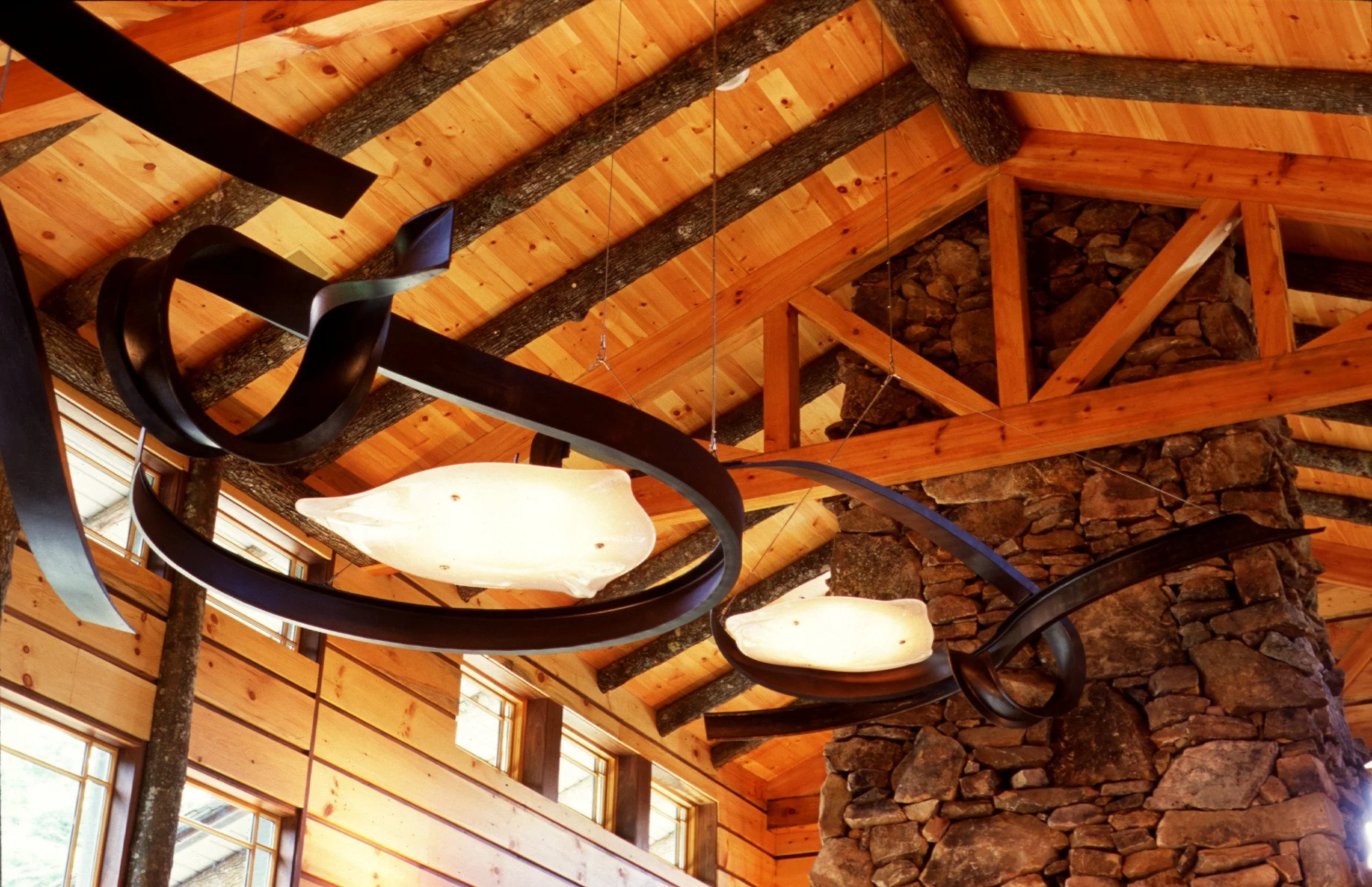 25'x9' ironwork chandeliers by Bill Brown; glasswork down in collaboration with Kenny Pieper
