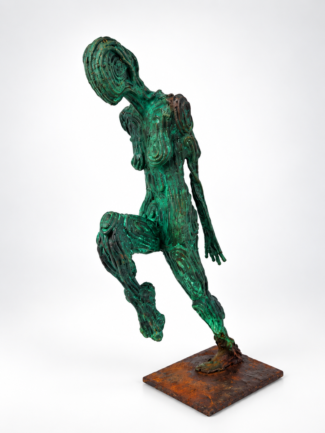 A sculpture of a solo dancer posed with hands forward and head down from front. Made by artist J. Aaron Alderman from steel round stock and finished with a copper patina.