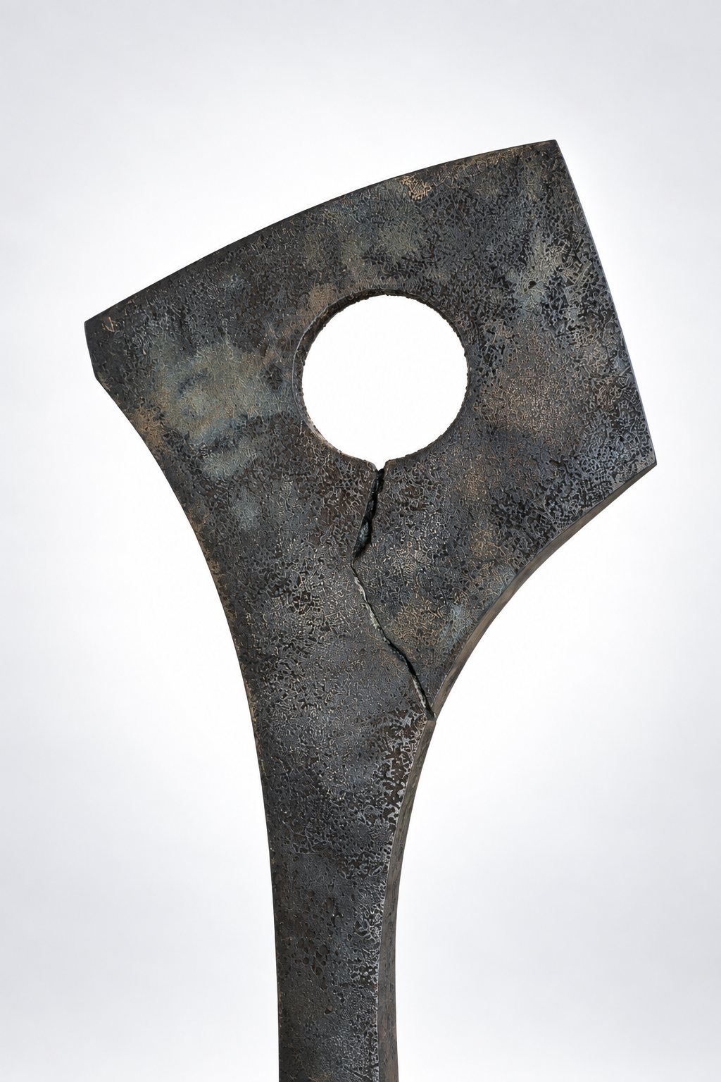 Detail shot of a metal sculpture by artist Kyle Lusk against a white gradient background.