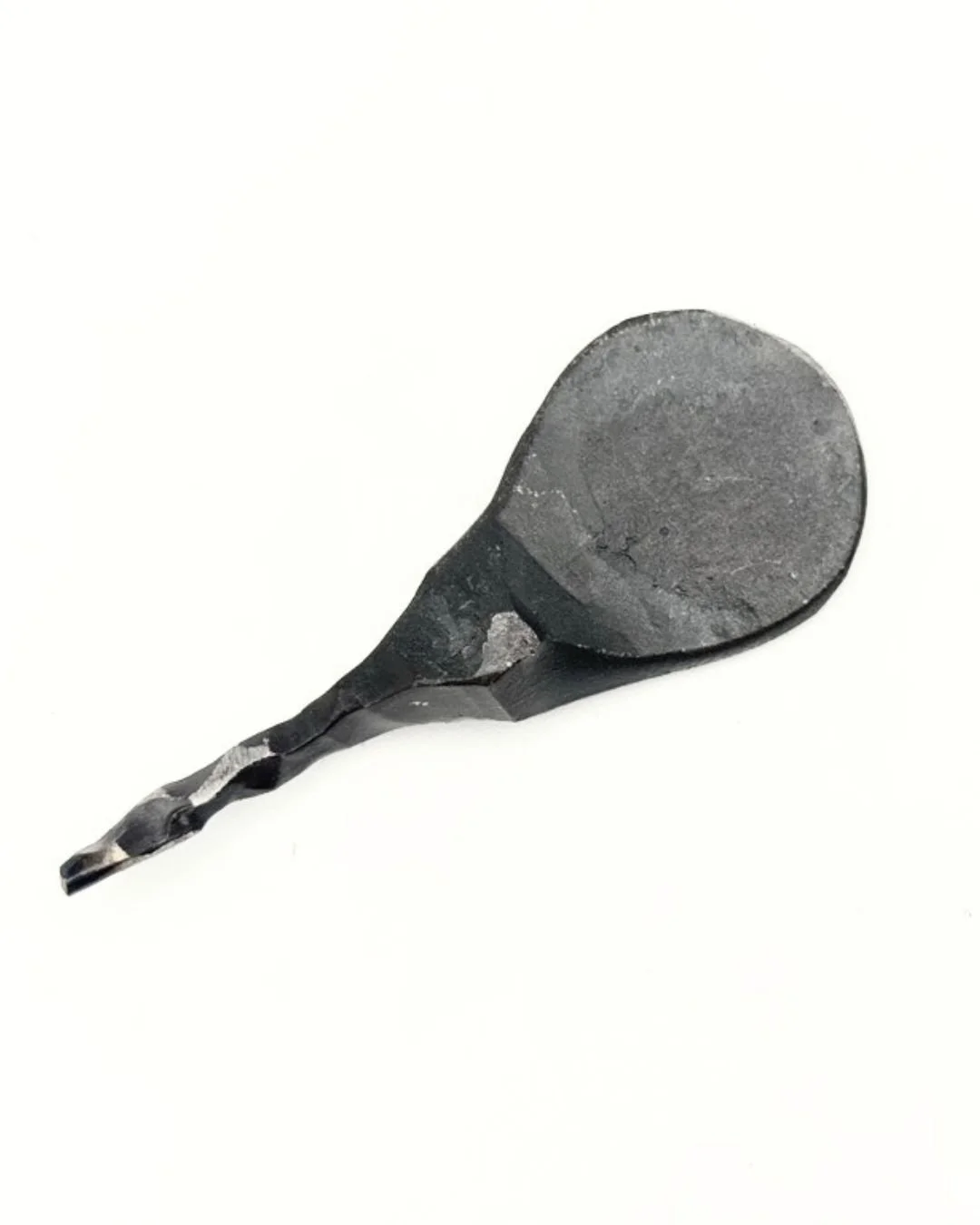 One steel divot tool with thumb print shape for golf on a white background.