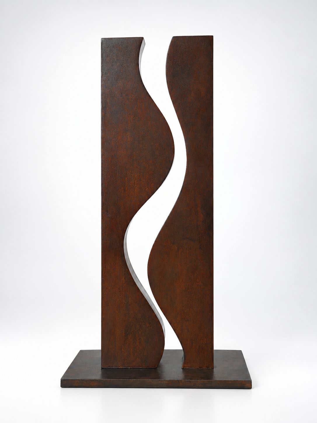 Metal sculpture in a wavy pattern that resembles smoke against a white gradient background.