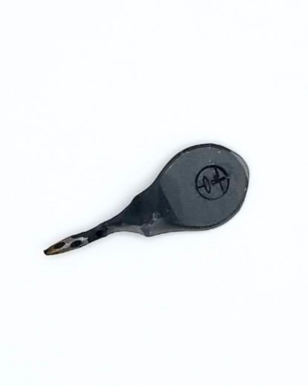 One steel divot tool with thumb print shape for golf on a white background.