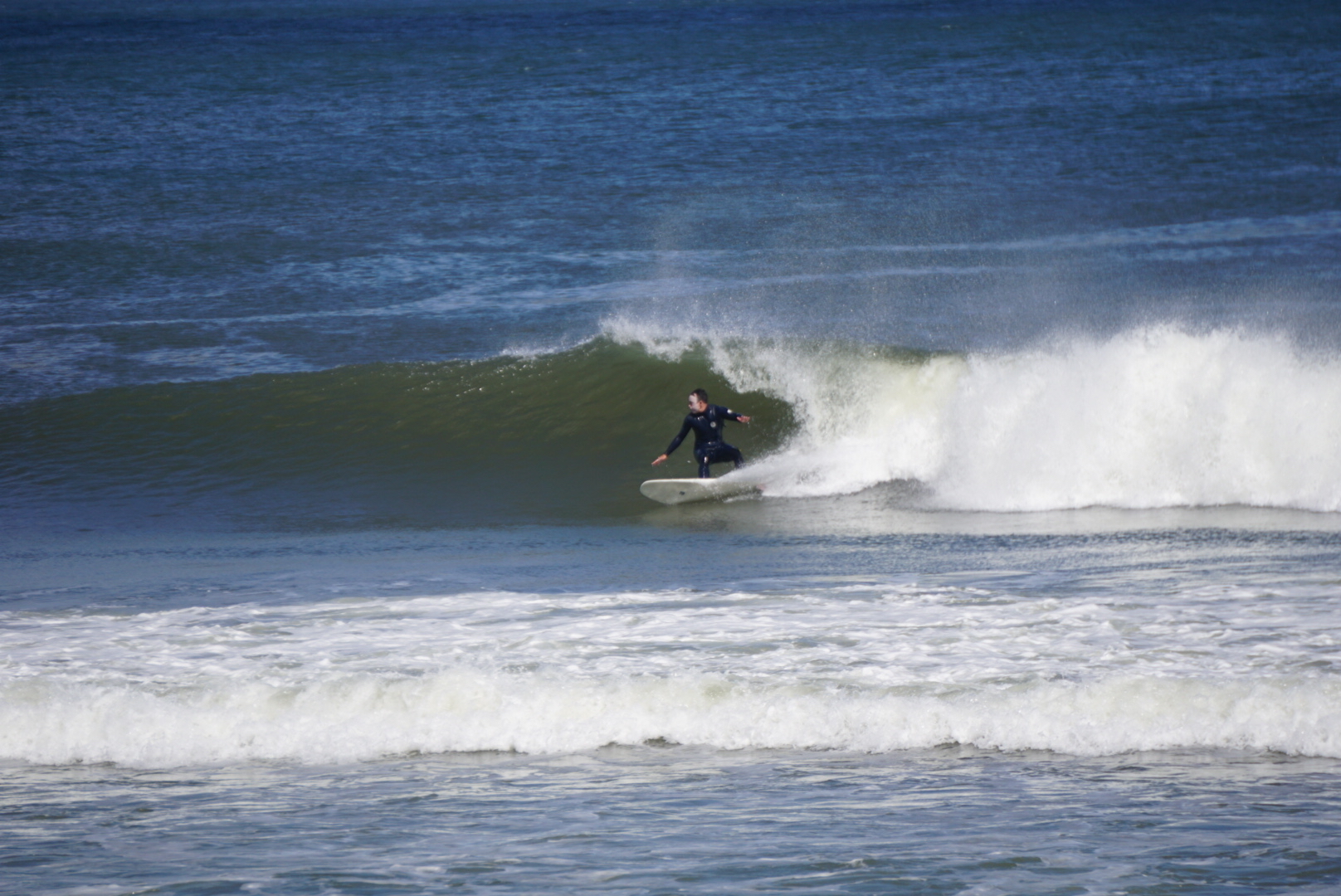 Dion laying into a bottom turn. Photo: Juan Heredia