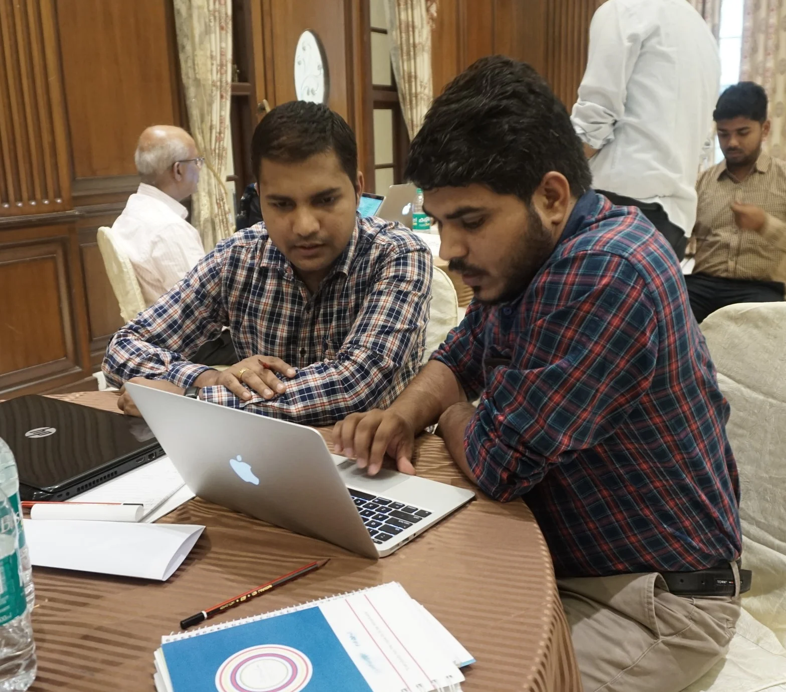 Amit Choudhary , Upaya’s Finance Management Associate works with Jitendra Yadav, founder of Aikya Organics on the company’s financial model during the 2018 Upaya Accelerator.