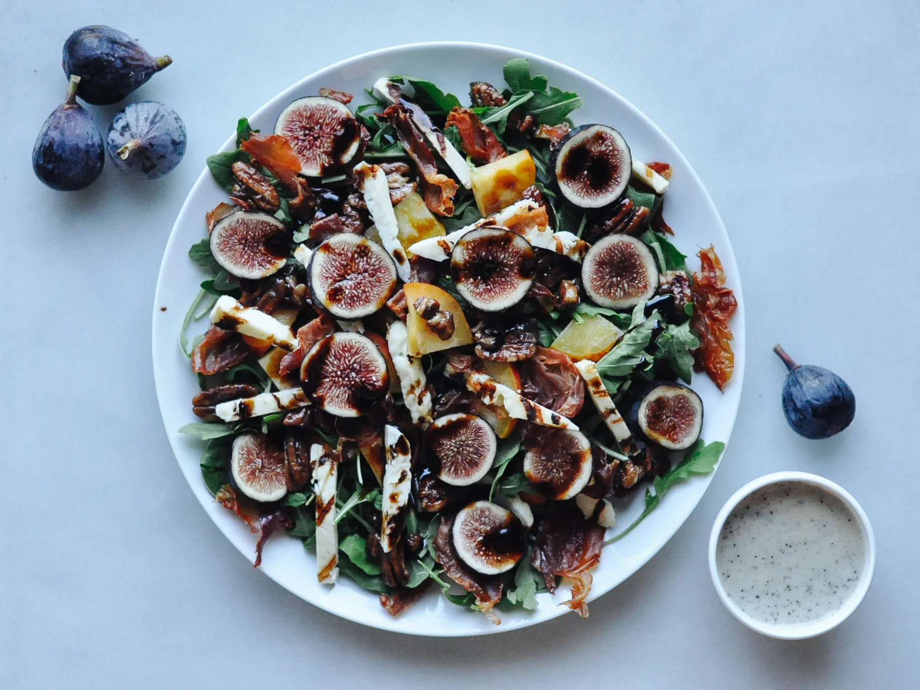 Arugula Salad w/Crispy Prosciutto, Grilled Halloumi, Balsamic Glaze, & Papaya Seed Dressing