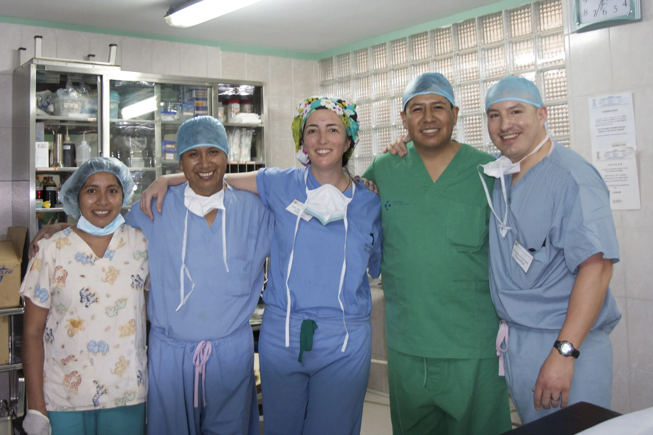 The complex surgeries we provide require a full team of skilled hands! Left to right: a local OR nurse, Dr. Jaime Vallejos, Dr. Gay Garrett, Dr. Jhonny Camacho (another General Surgery Program partner), and mission team anesthesiologist Dr. Marco Fernández .