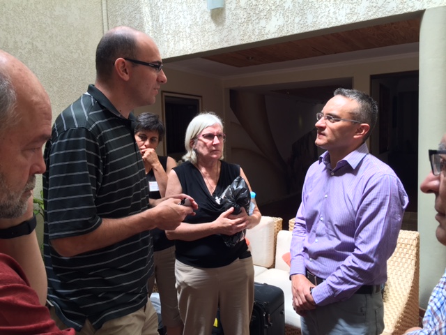 U.S. neurosurgeons Dr. Alec Vaezi and Dr. Richard Moser, accompanied by Senior Director of Programs Mary McCann Sanchez, discuss mission cases with Bolivian ear, nose and throat specialist, Dr. Marcelo Ugarte. 
