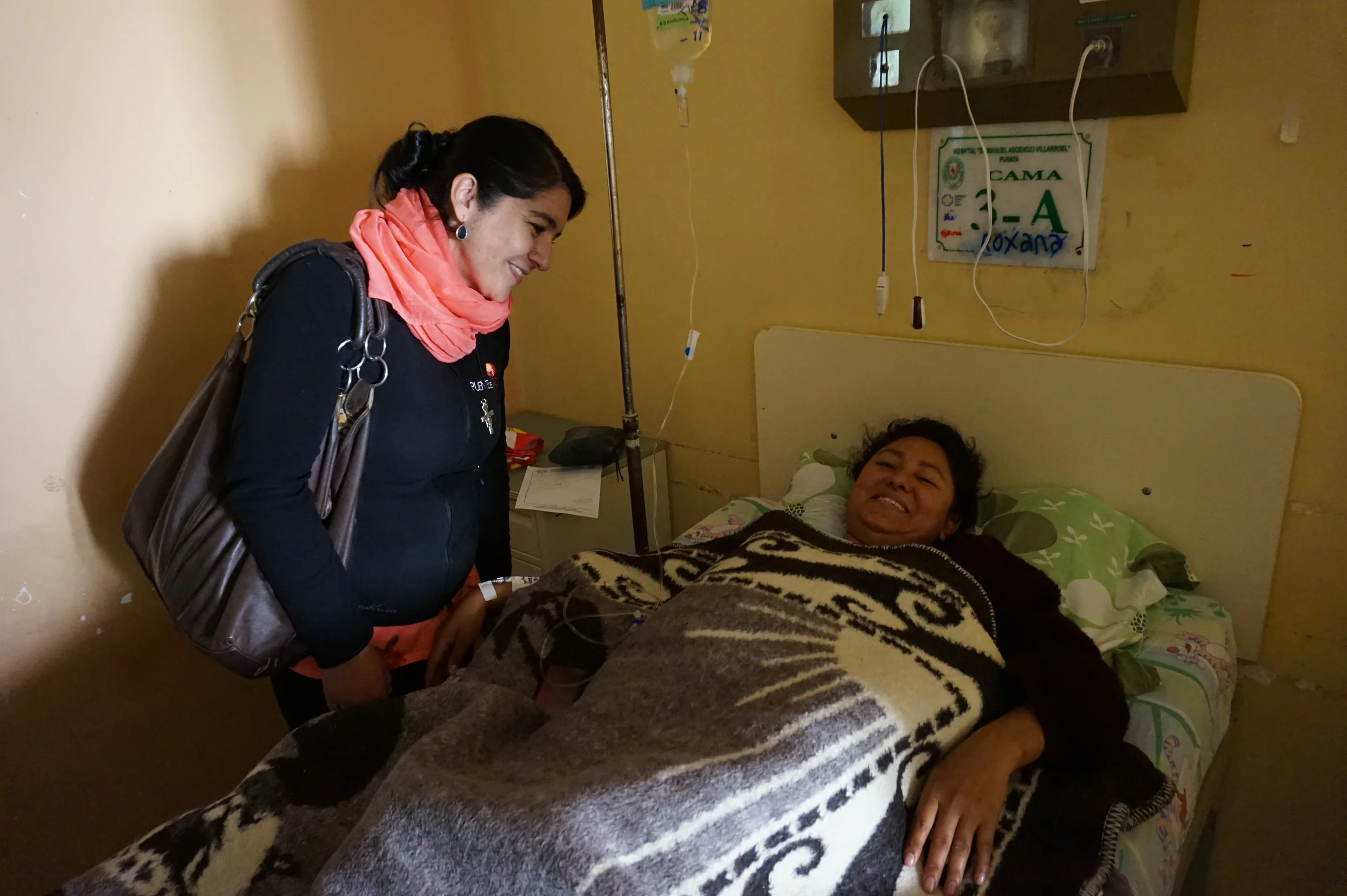 Marcela visits with hospital patients. 